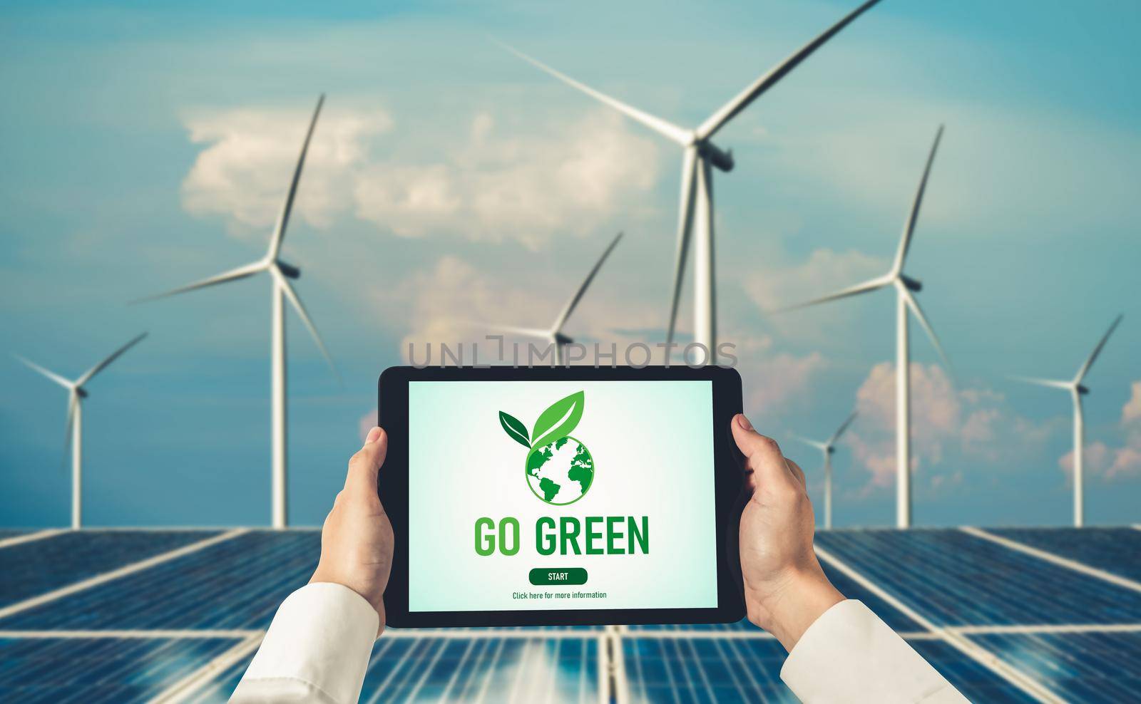 Green business transformation for environment saving and ESG business concept. Businessman using tablet to set corporate goal toward environmental friendly management and alternative clean energy use.