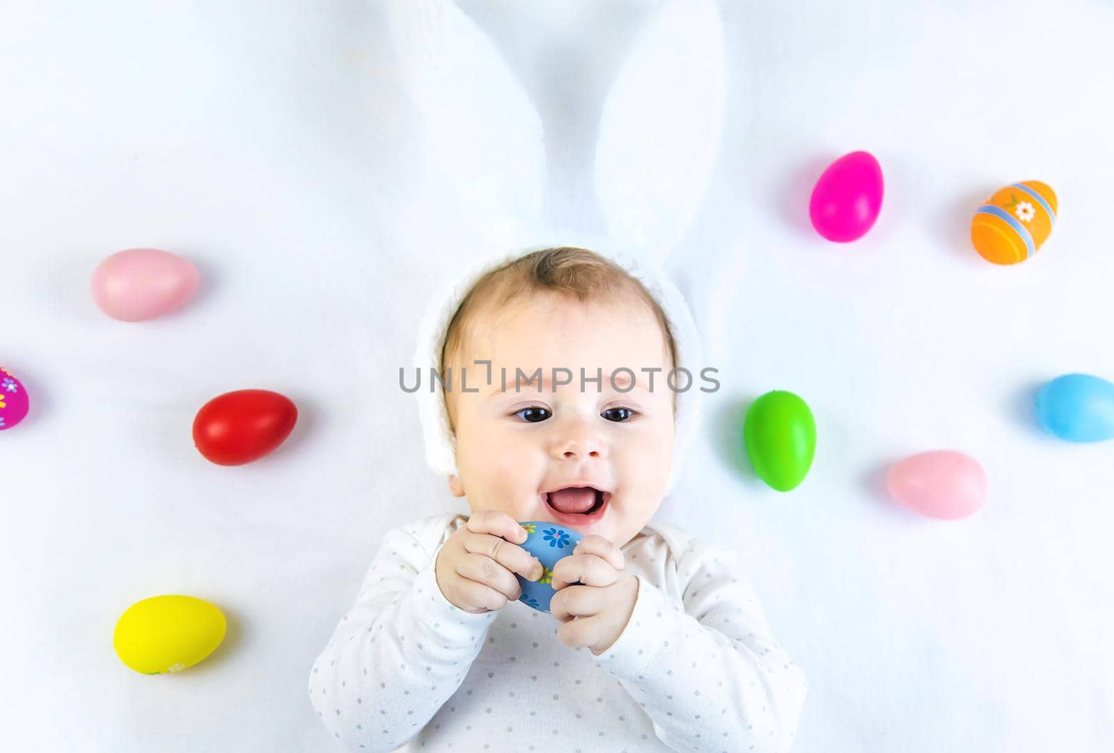 Happy easter baby holiday concept on white background. Selective focus. Child.