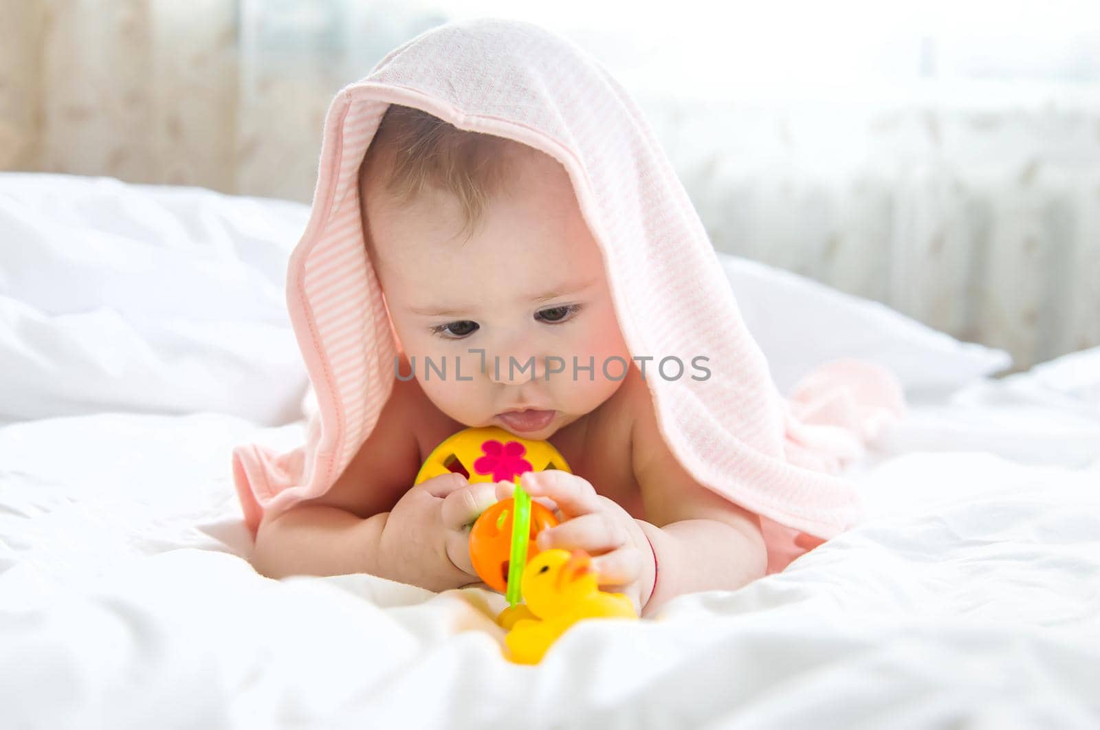 Baby after bathing in a towel. Selective focus. Child.