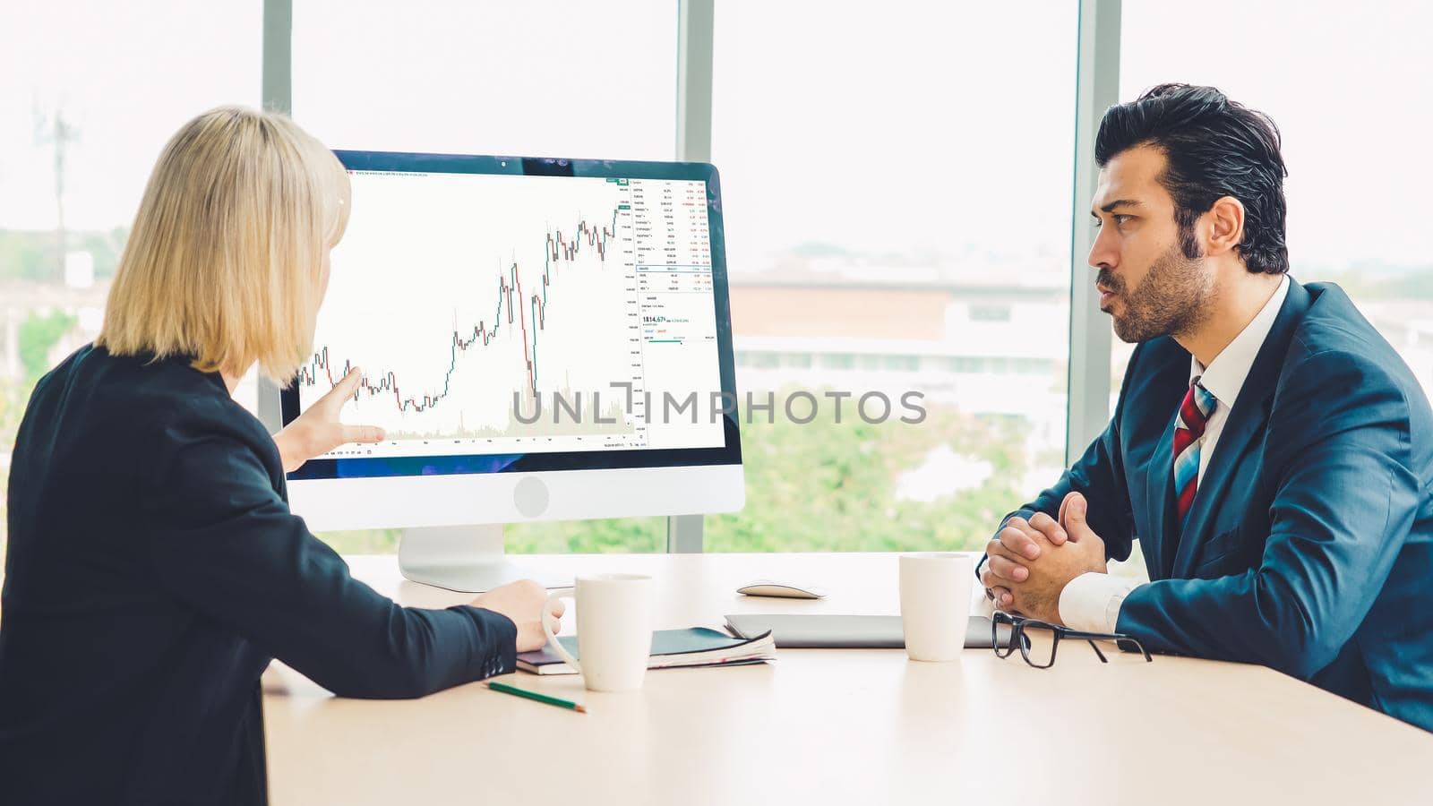 Stock market data chart analysis by ingenious computer software . Investment application display stock market chart on the computer screen and advise trading decision .