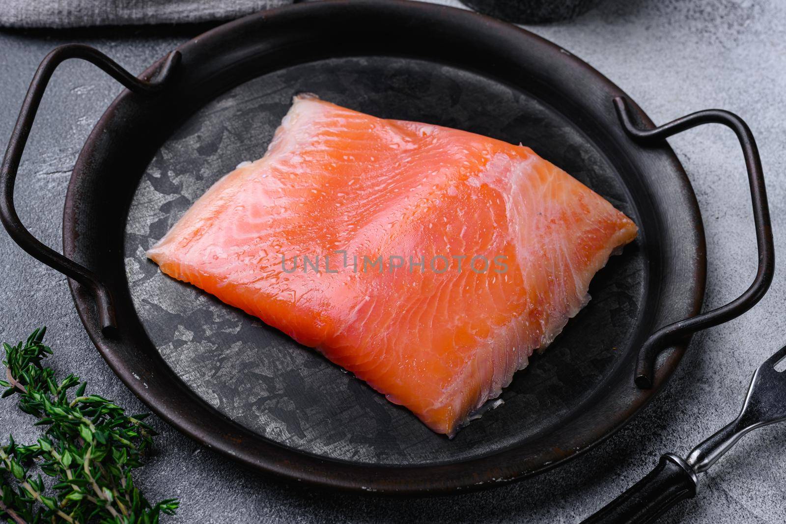 Fresh fish. Salmon fillet set, on gray stone table background by Ilianesolenyi