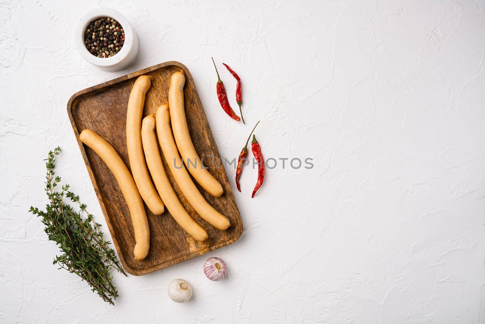 Fresh meat hot dog sausages set, on white stone table background, top view flat lay, with copy space for text