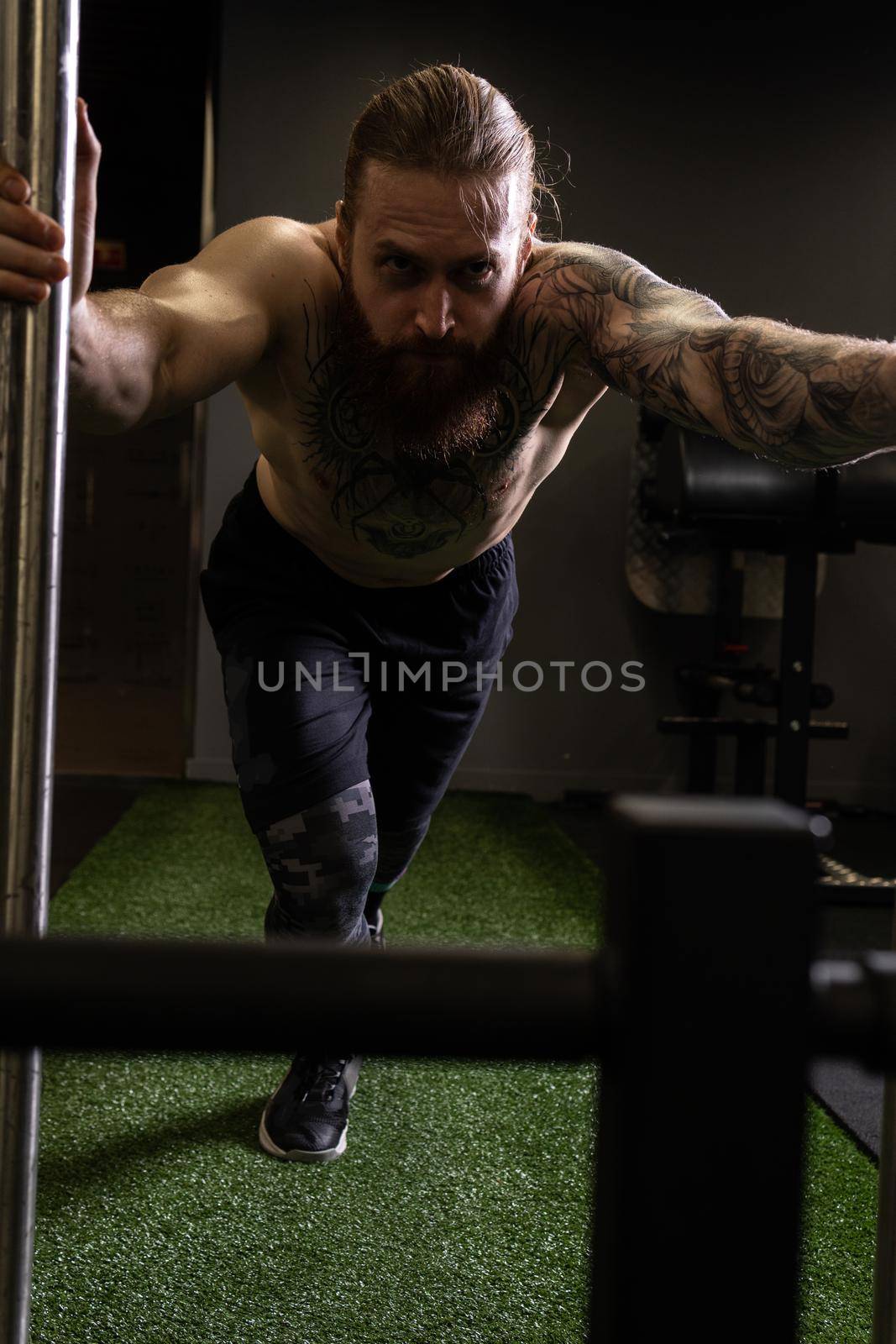 Tattoo adult athlete beard sleigh push athletic attractive body brunette, from drag equipment in healthy for heavy muscle, physical prowler. Strong women workout, by 89167702191