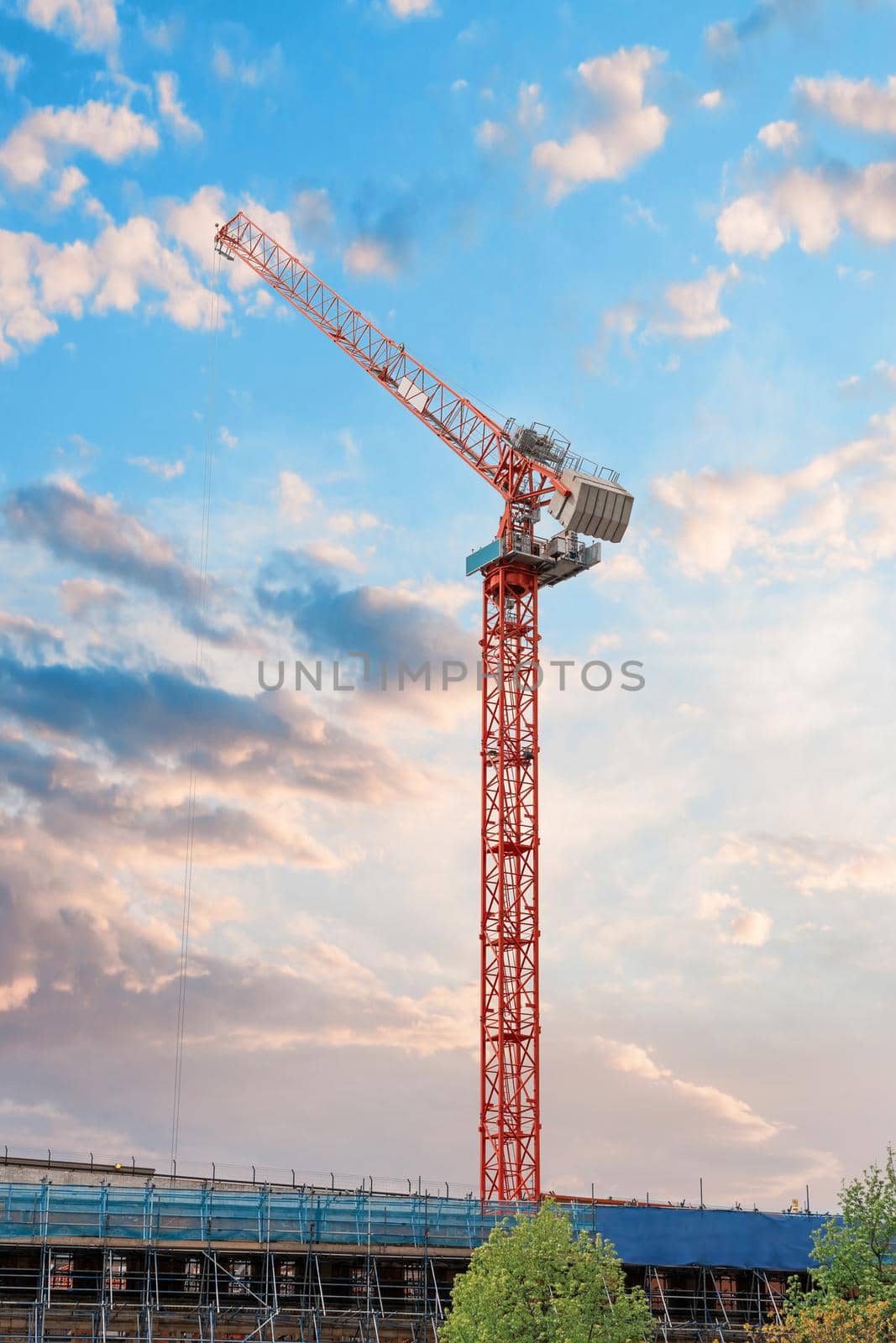 Tower crane on a dramatic sky background