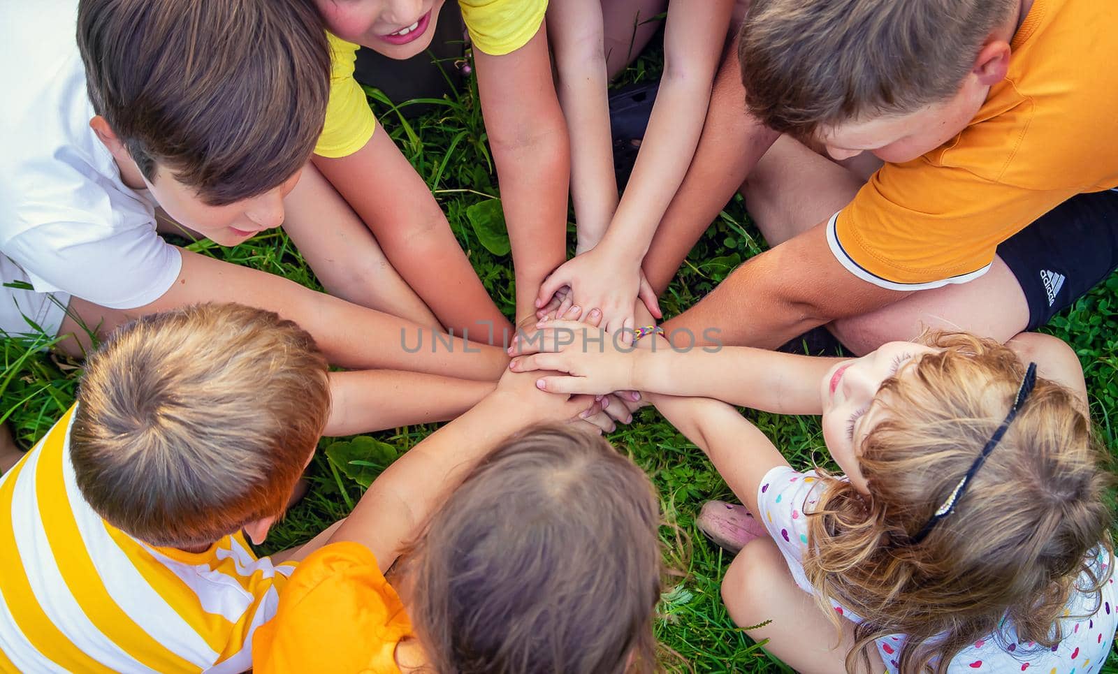 Children are playing with their hands clasped together. Selective focus. by yanadjana