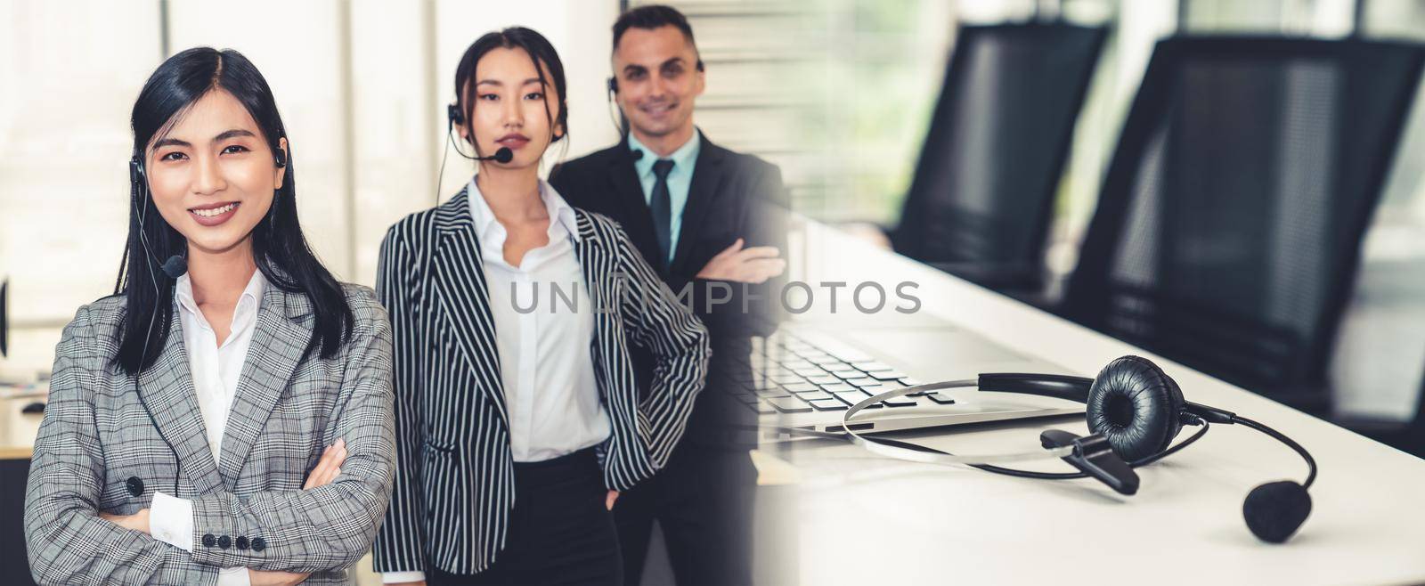 Business people wearing headset working in office broaden view by biancoblue