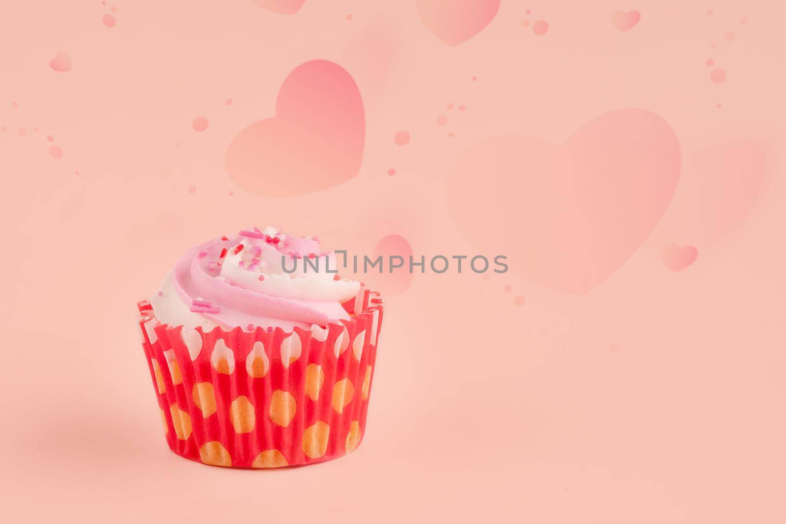berry muffin in red wrappers on a pink background high-quality photos for calendar and cards. Space for text by Iryna_Melnyk