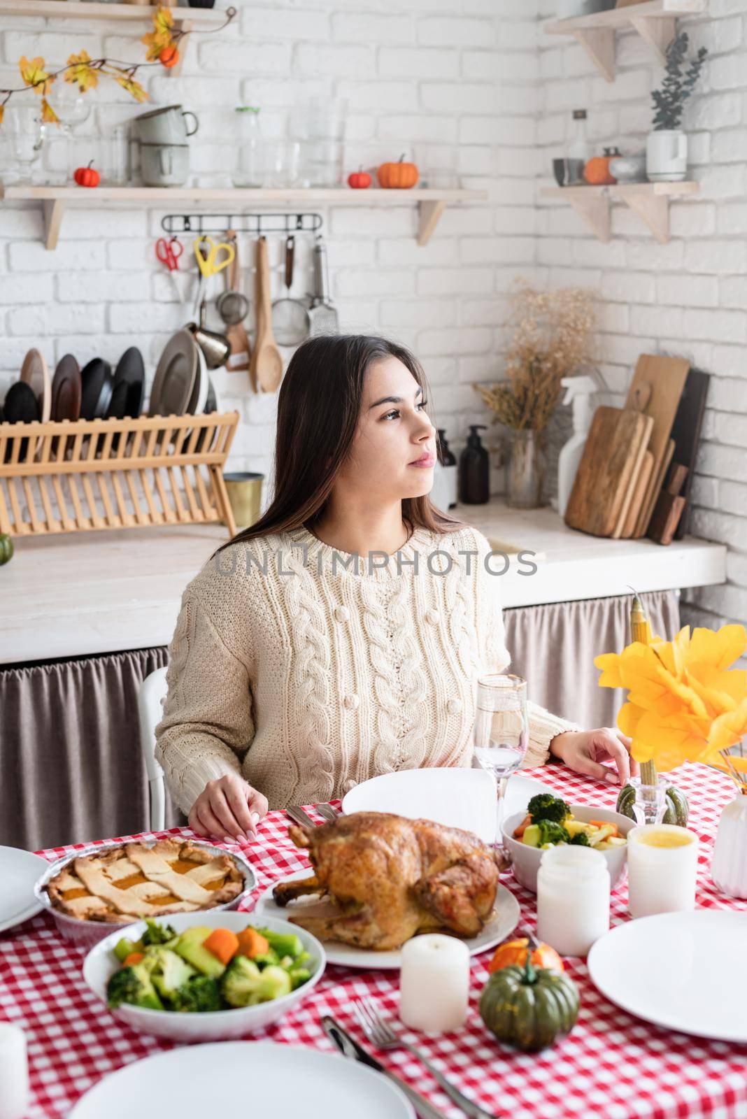 woman preparing thanksgiving dinner at home kitchen, decorating by Desperada