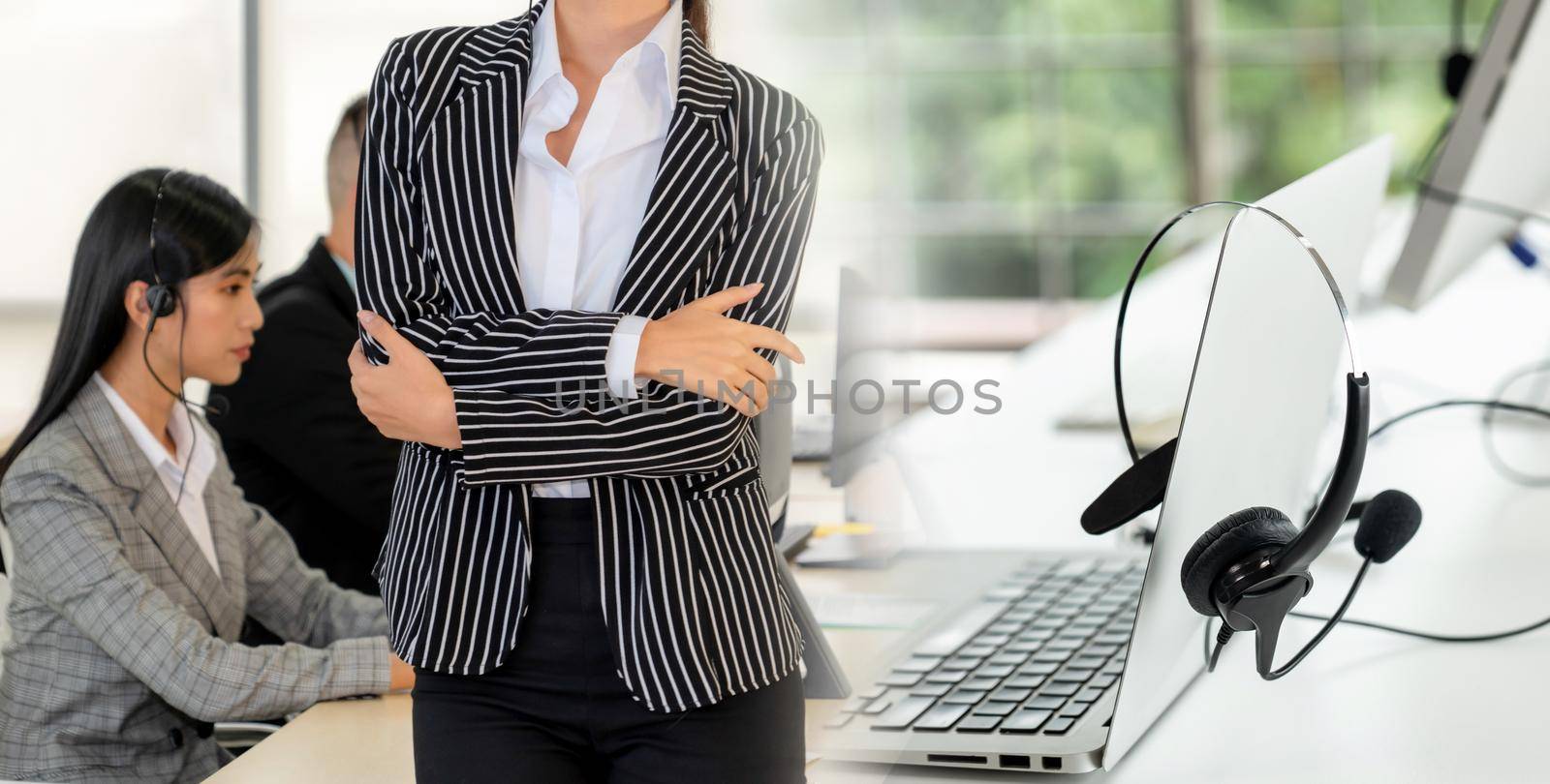 Business people wearing headset working in office to support remote customer or colleague. Call center, telemarketing, customer support agent provide service in broaden view .