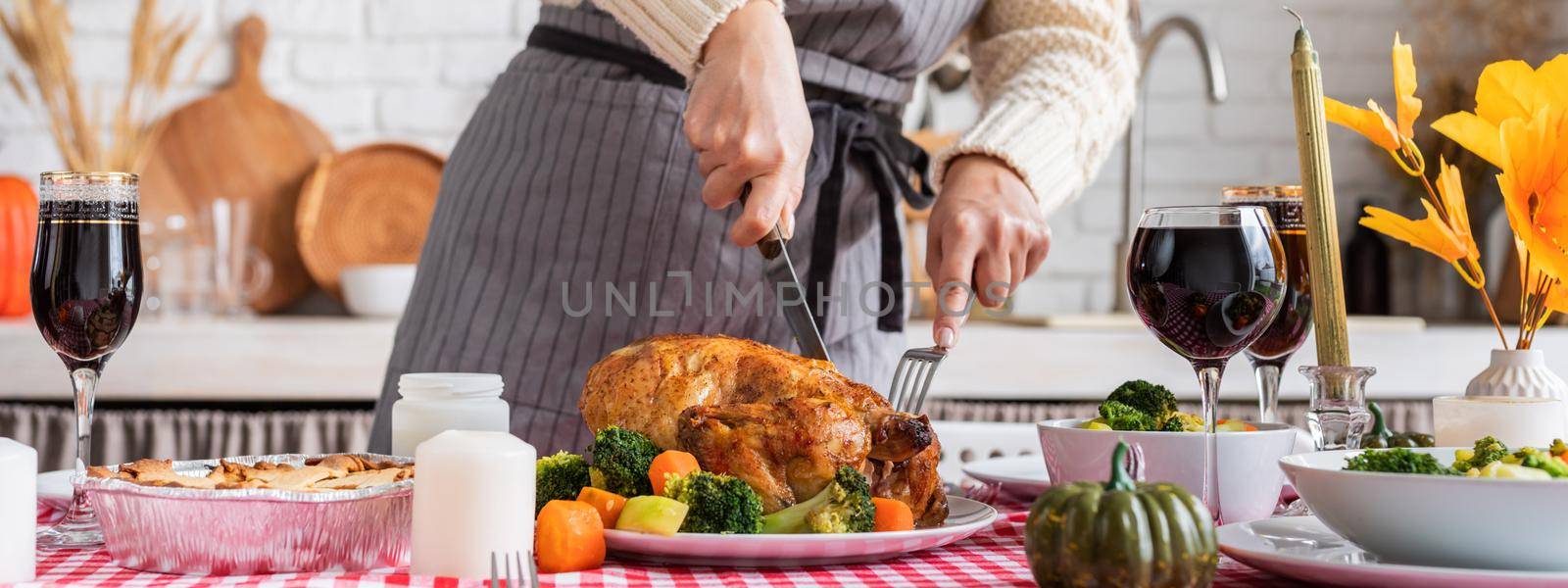 woman preparing thanksgiving dinner at home kitchen, decorating by Desperada