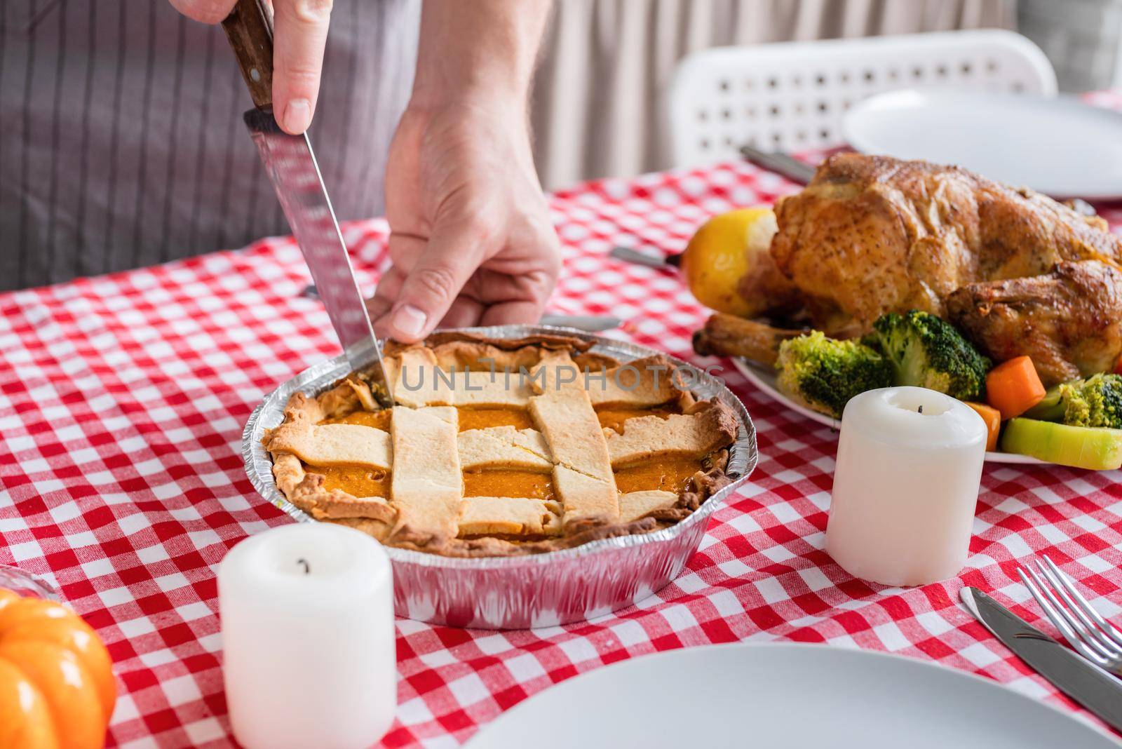 woman preparing thanksgiving dinner at home kitchen by Desperada