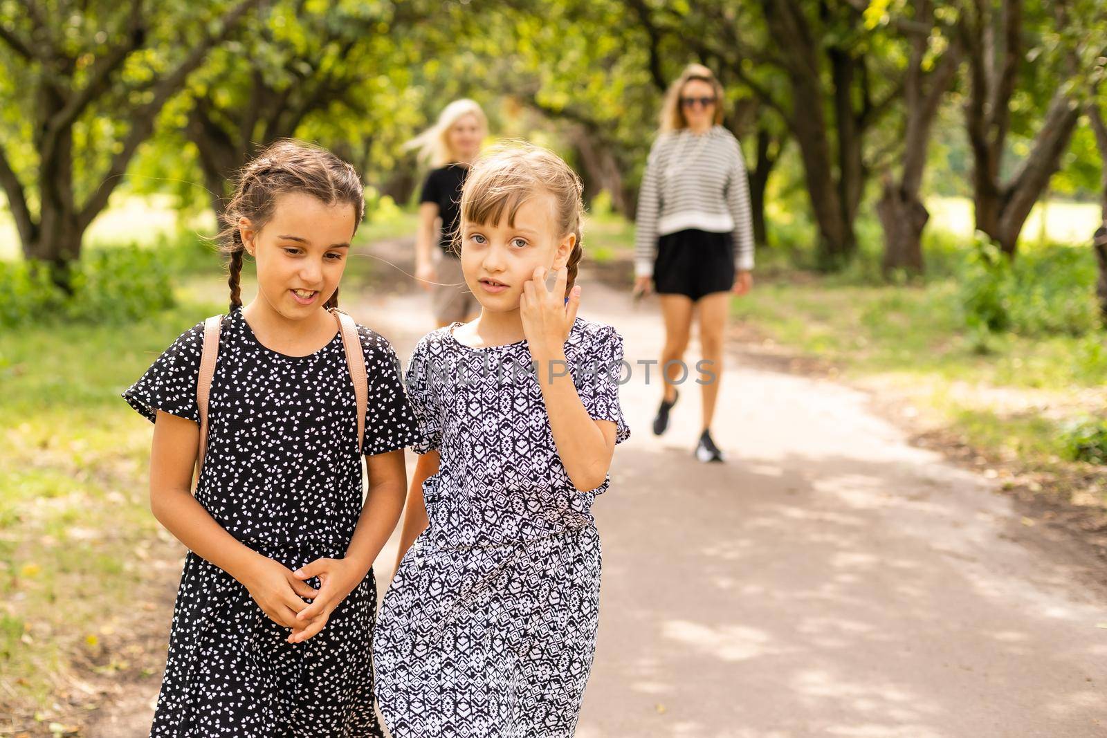 Basic school students crossing the road.