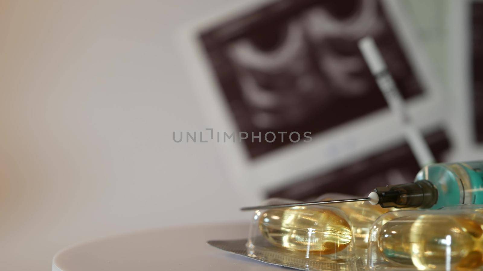 IVF or in vitro fertilisation, reproductive assisted technology, infertility or sterility treatment. Ultrasound or ultrasonography, pregnancy test, syringe and pills. Hormonal drugs for stimulation.