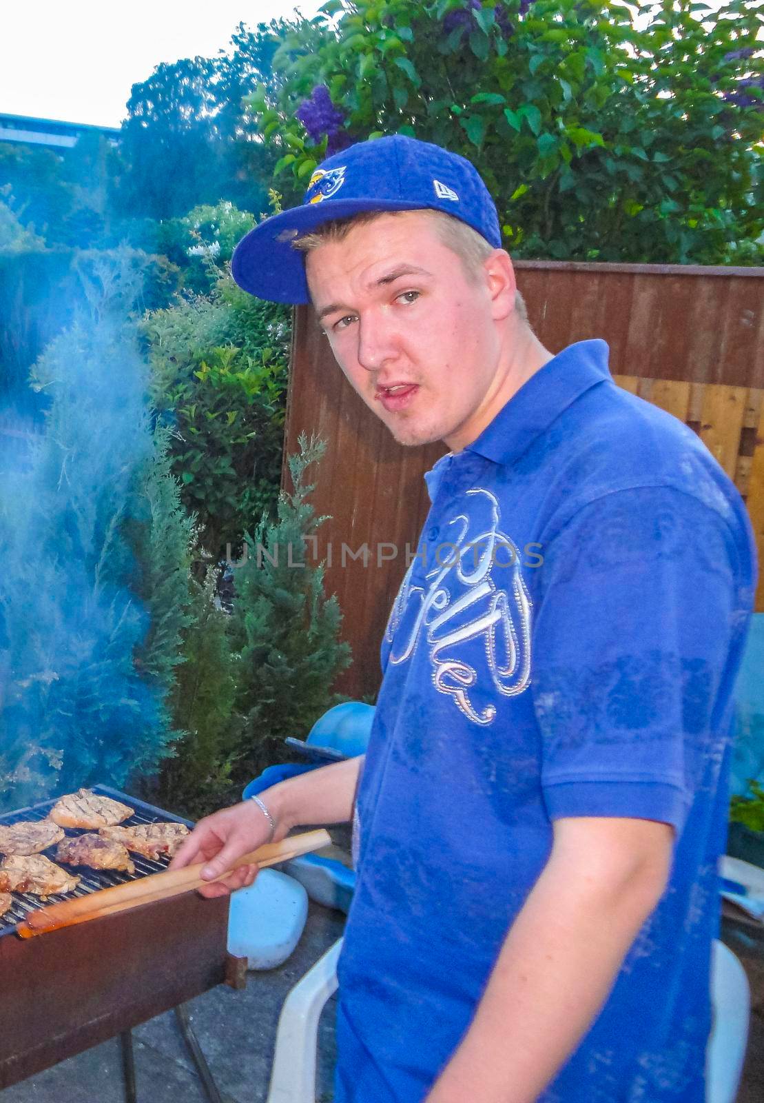 Preparing Barbeque BBQ Campfire and sausages meat steak chicken in Speckenbütteler Park Lehe Bremerhaven Bremen Germany.