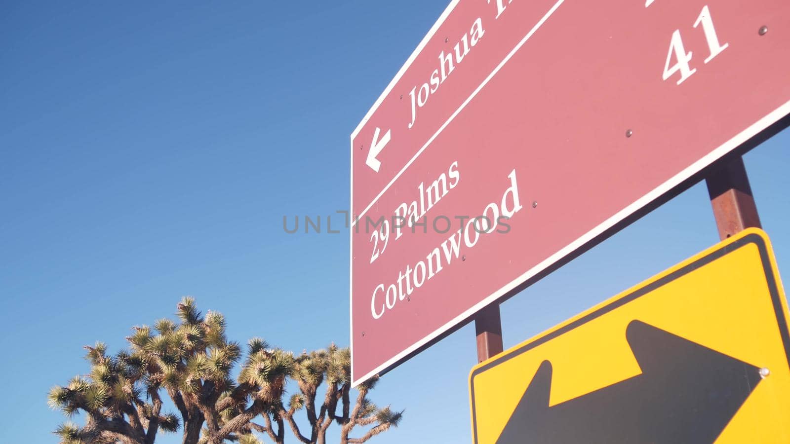 Crossroad sign, road intersection, California USA. Joshua Tree desert wilderness by DogoraSun