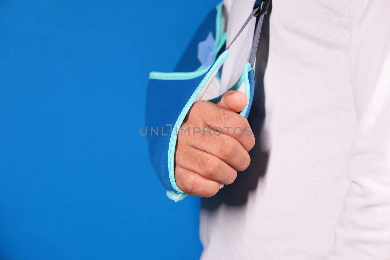 young man wearing an arm brace for broken hand