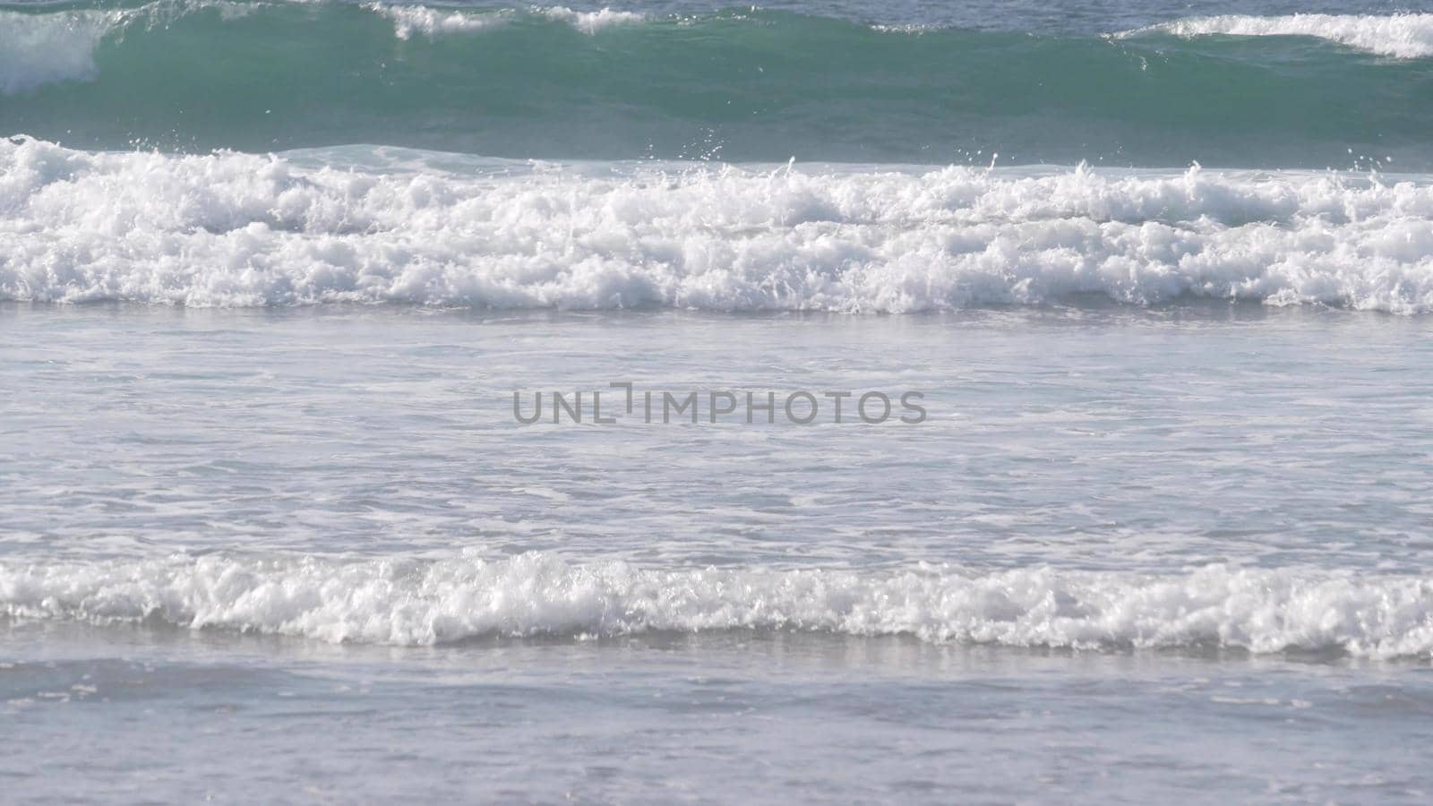 Big blue ocean waves crashing on beach, California pacific coast, USA. Sea water by DogoraSun