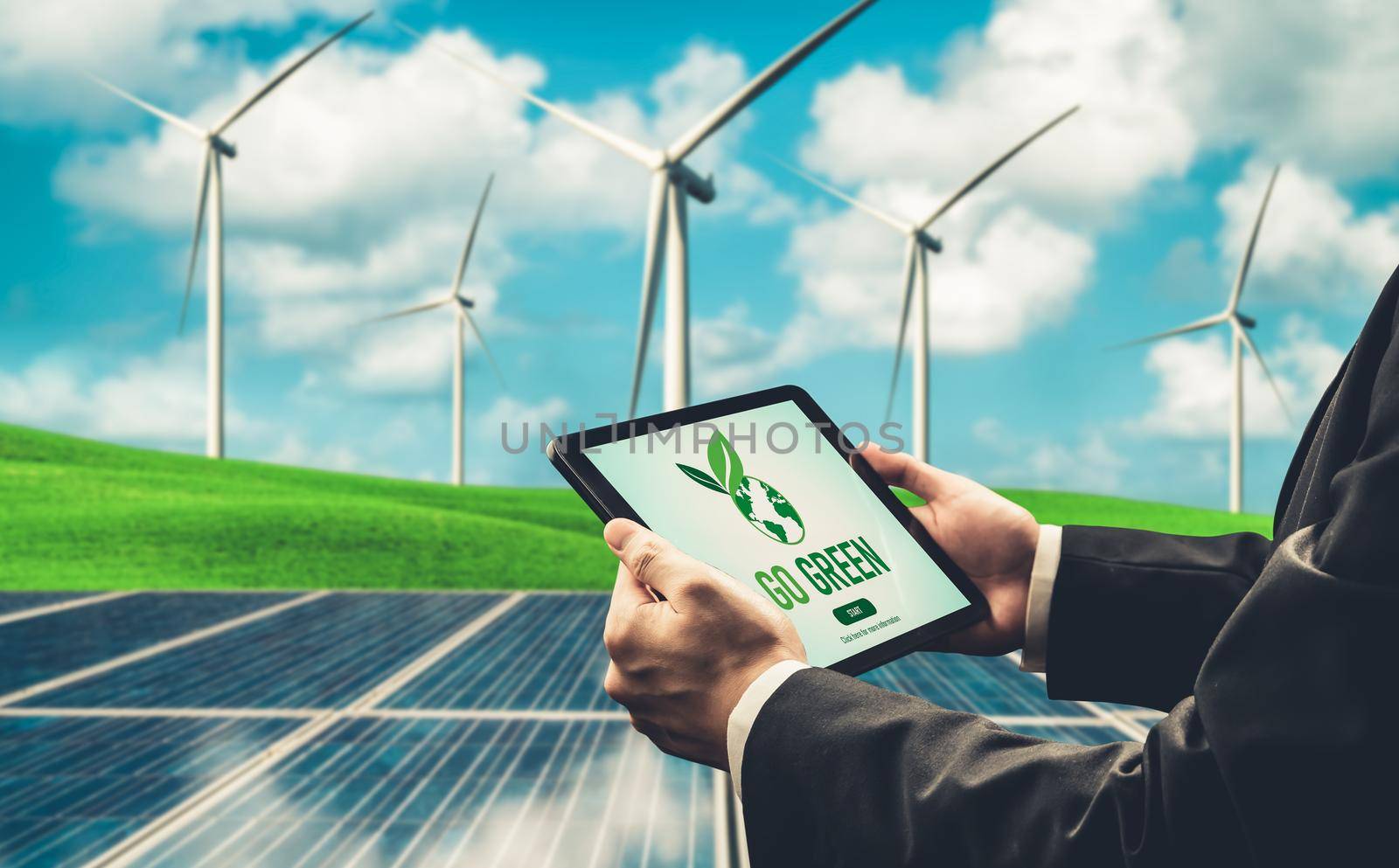 Green business transformation for environment saving and ESG business concept. Businessman using tablet to set corporate goal toward environmental friendly management and alternative clean energy use.