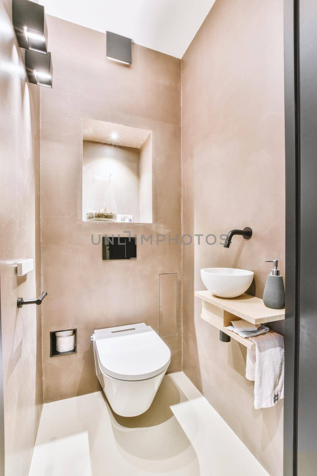 Sink base cabinet and mirror cabinet in white tiled bathroom with wall hung toilet