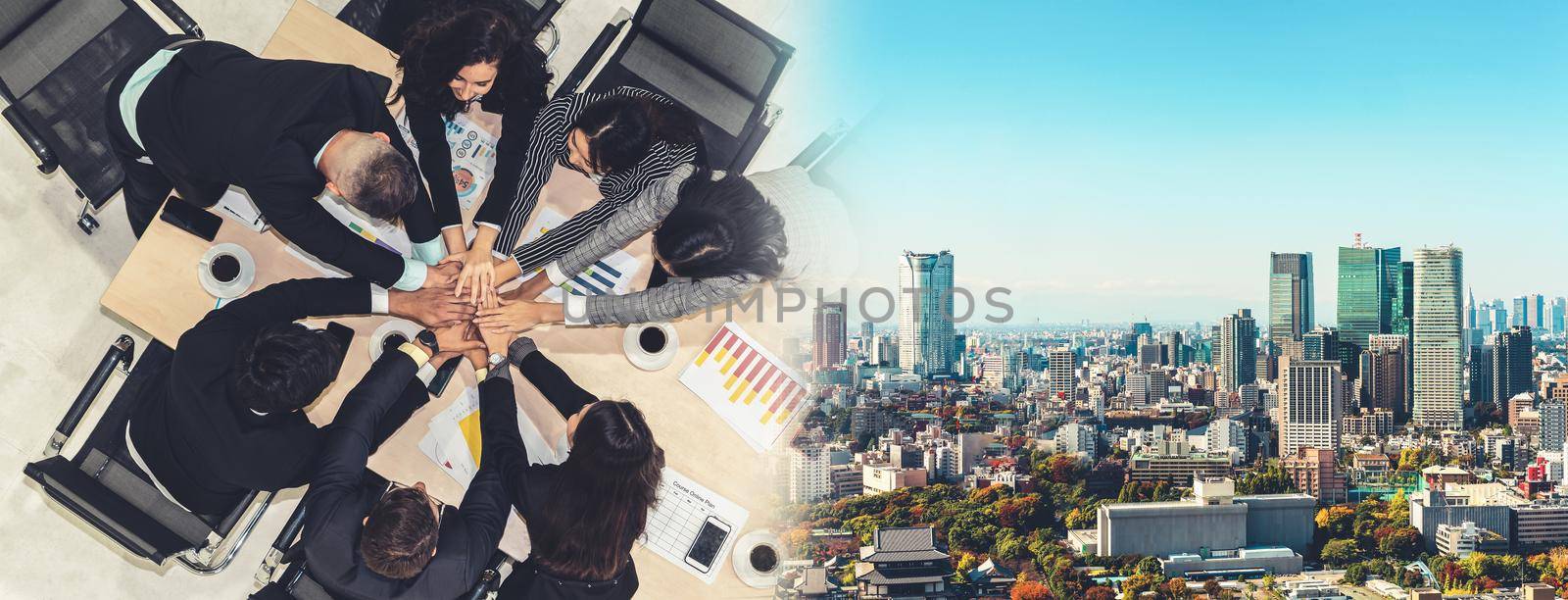 Happy business people celebrate teamwork success together with joy at office table shot from top view . Young businessman and businesswoman workers express cheerful victory in broaden view .