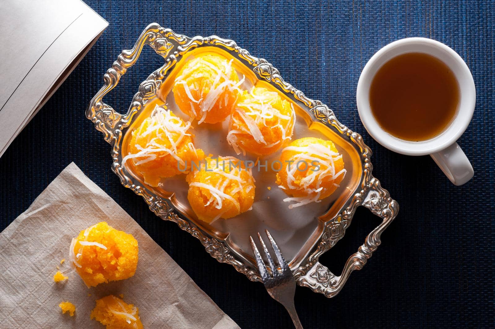 Toddy palm cake or Kanom Tan, Thai traditional dessert. Khanom tan is made from rice flour, ripe sugar palm fruit, coconut milk, scraped coconut, sugar and salt.