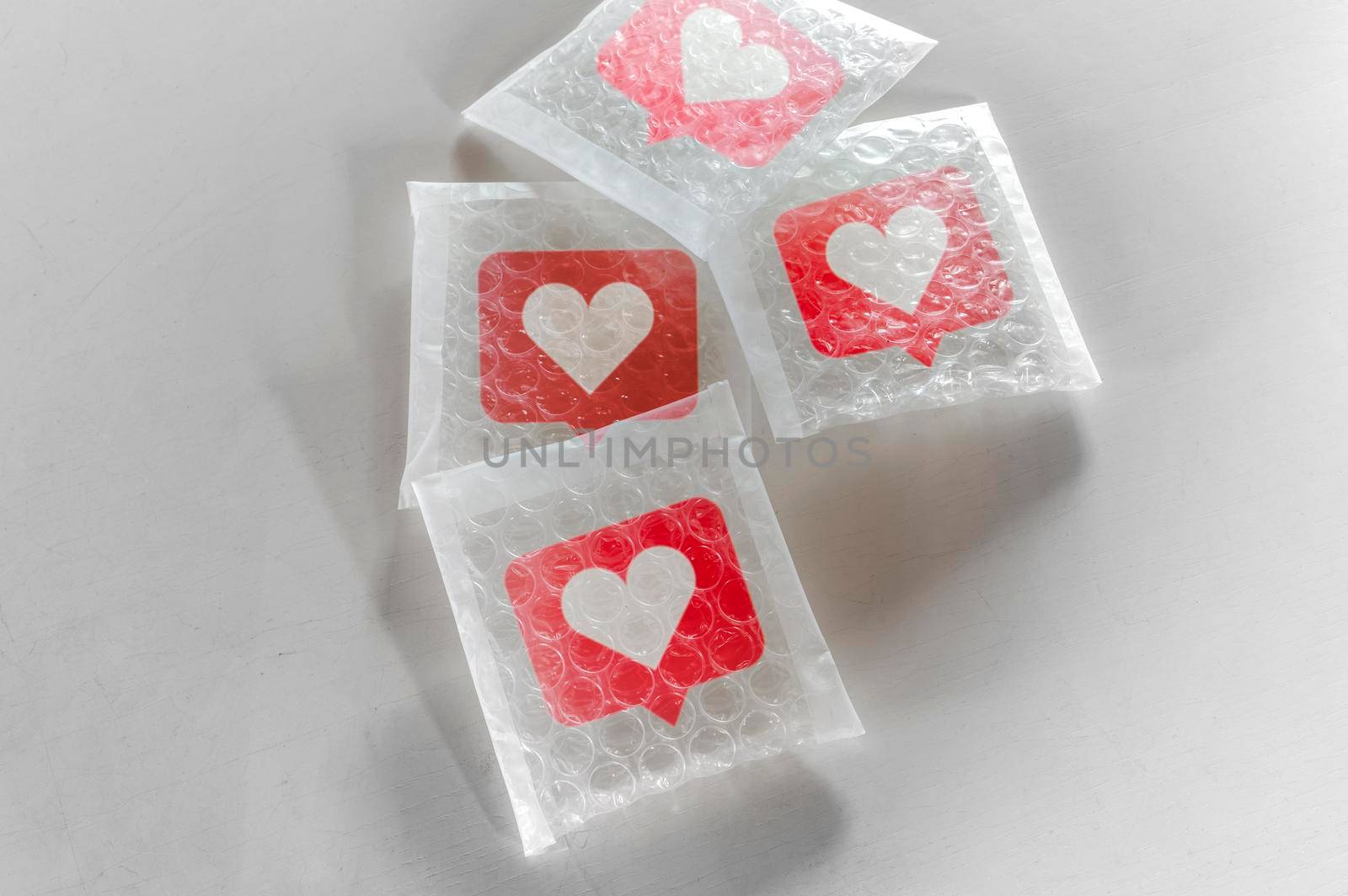 Packaging social symbols and icons with bubble wrap.