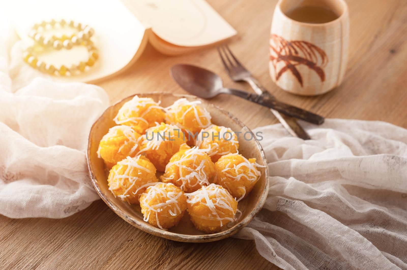 Toddy palm cake or Kanom Tan, Thai traditional dessert. Khanom tan is made from rice flour, ripe sugar palm fruit, coconut milk, scraped coconut, sugar and salt.