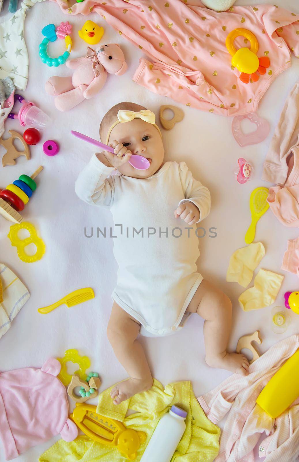 Baby with clothes and accessories. Selective focus. People.