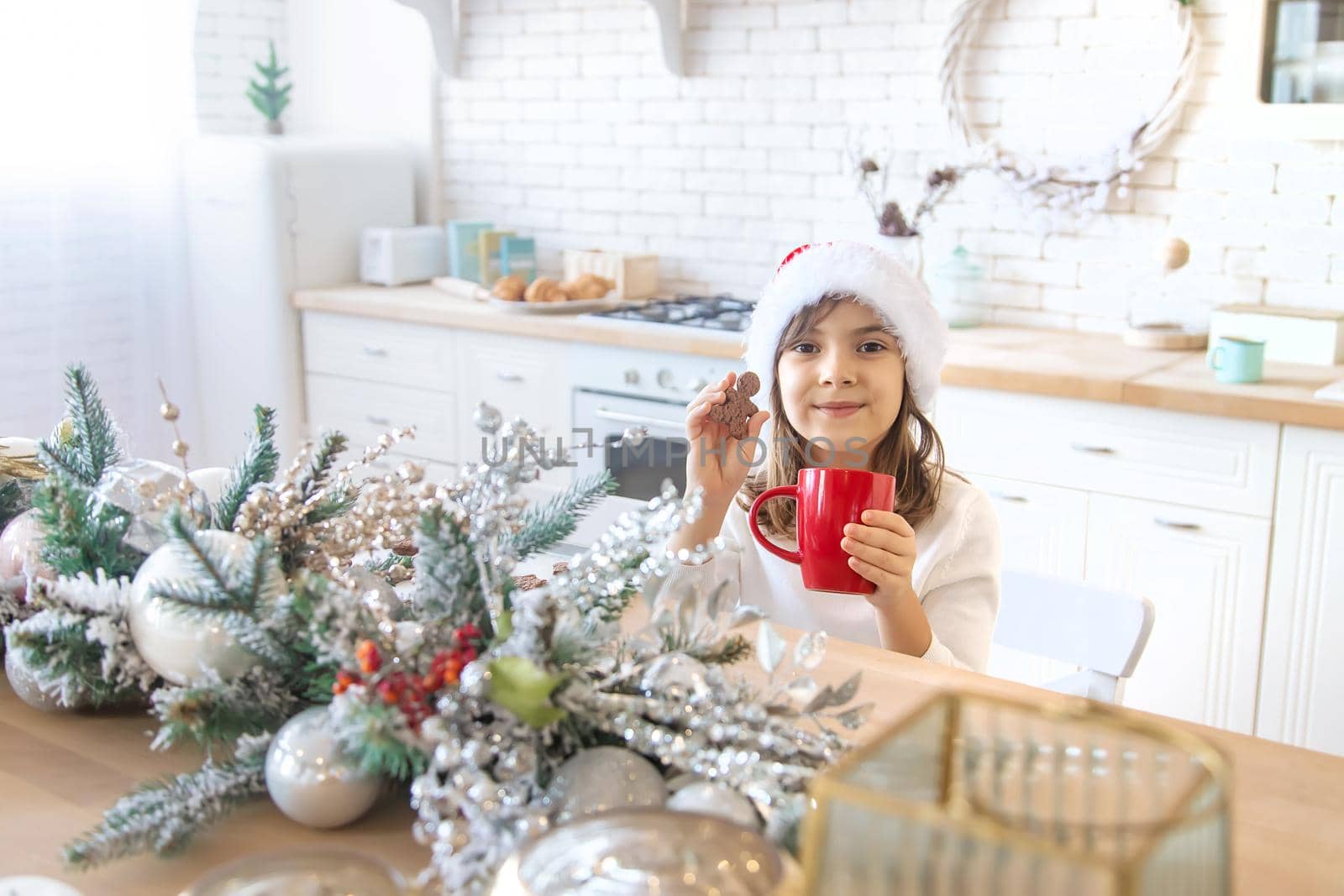 The child bakes and tastes Christmas cookies. Selective focus. holiday.