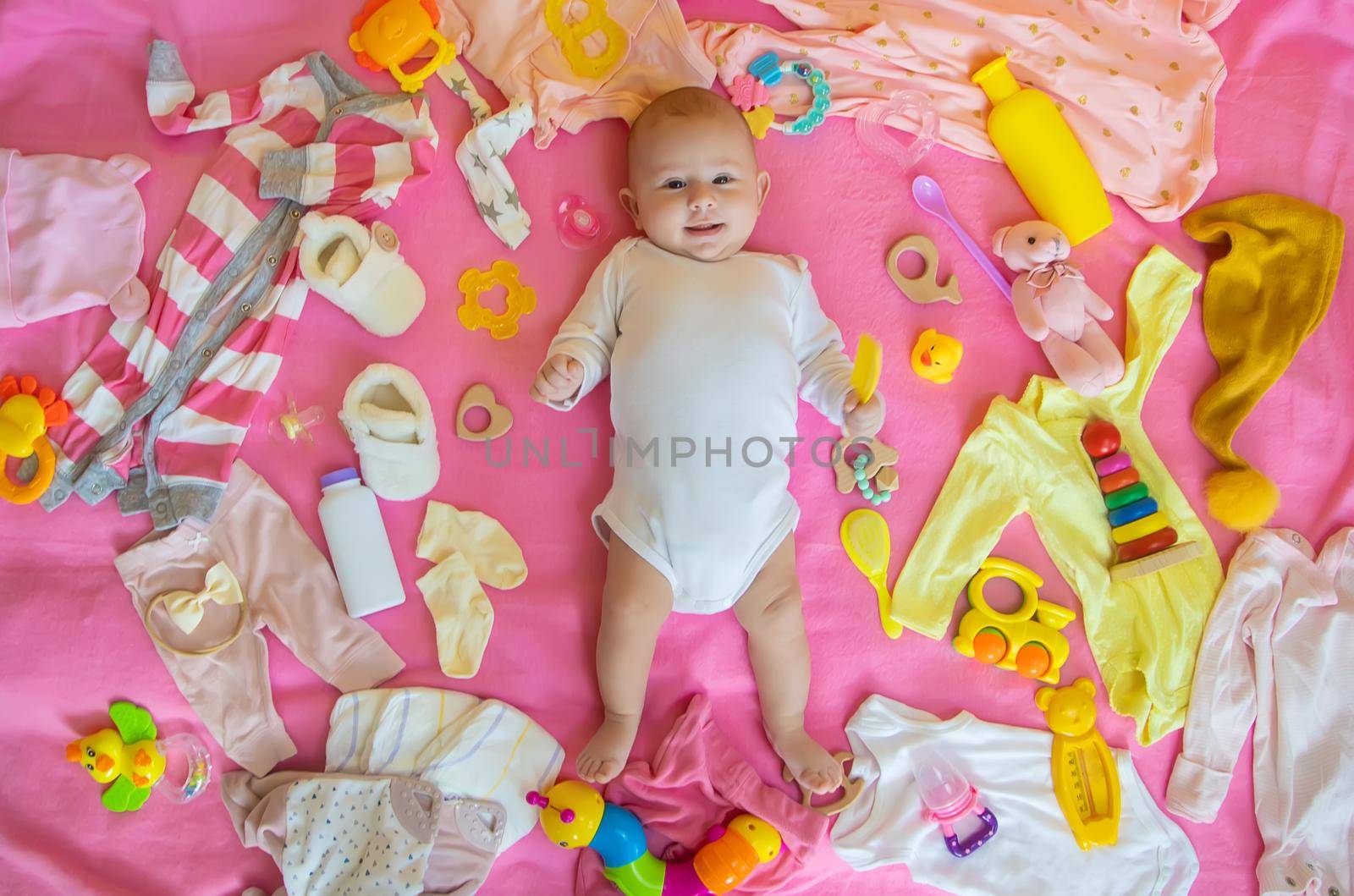 Baby with clothes and accessories. Selective focus. People.