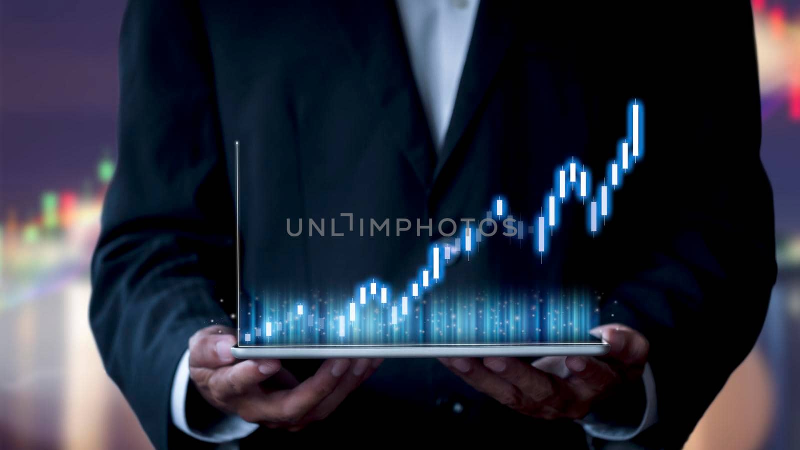 Hand of businessman holding tablet analysis stock market graph growth and increase of chart positive indicators. Hand holding tablet show stock chart on light gray background. copy space banner