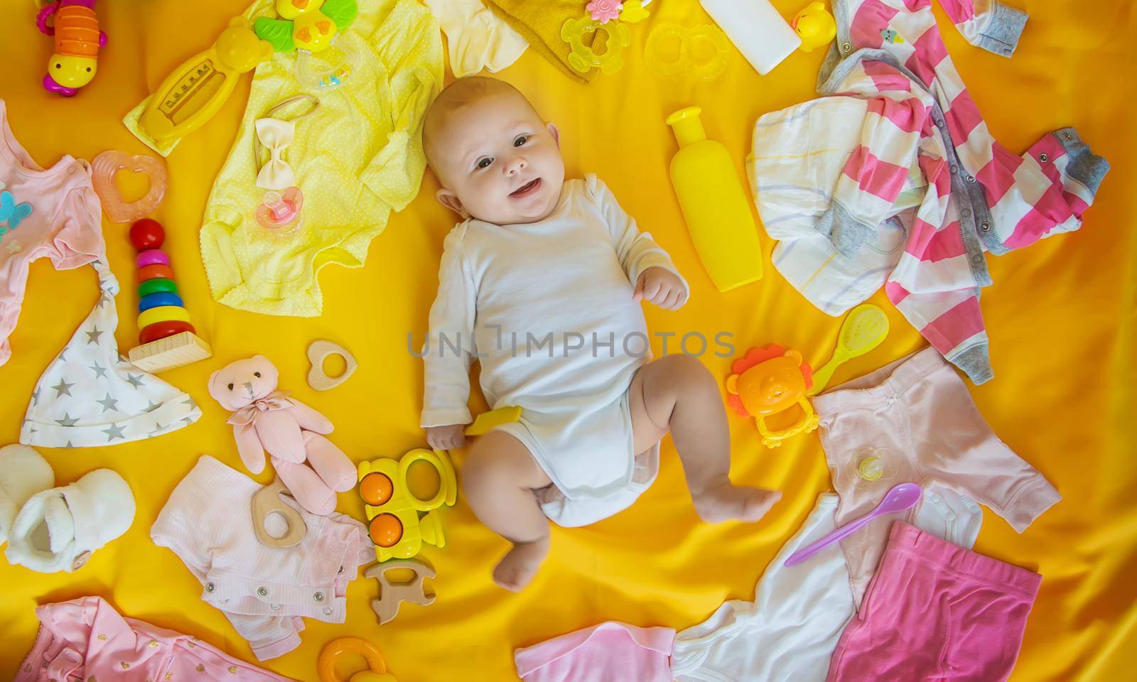 Baby with clothes and accessories. Selective focus. People.