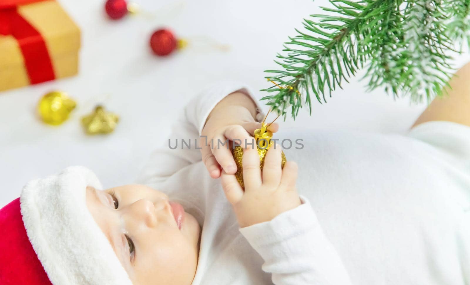 Christmas photo of baby with New Year's decor. selective focus. holiday.