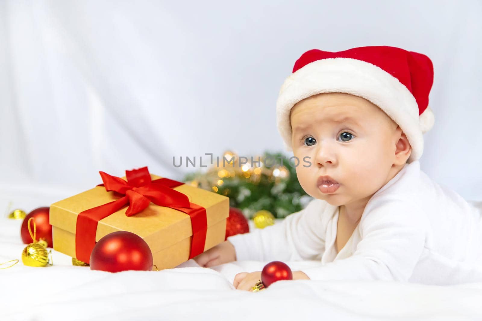 Christmas photo of baby with New Year's decor. selective focus. holiday.