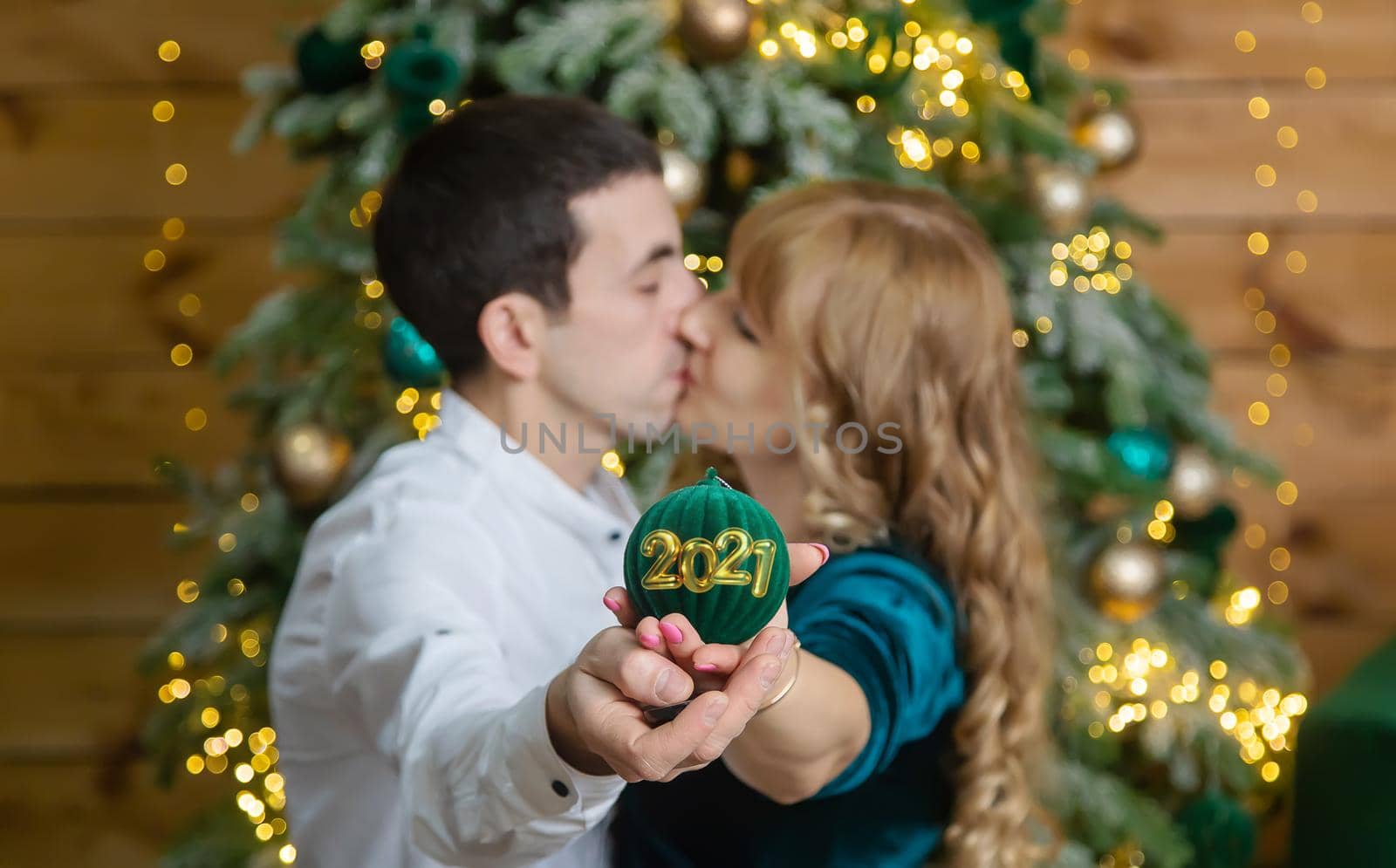 Christmas man and woman hold decoration. Selective focus. by yanadjana