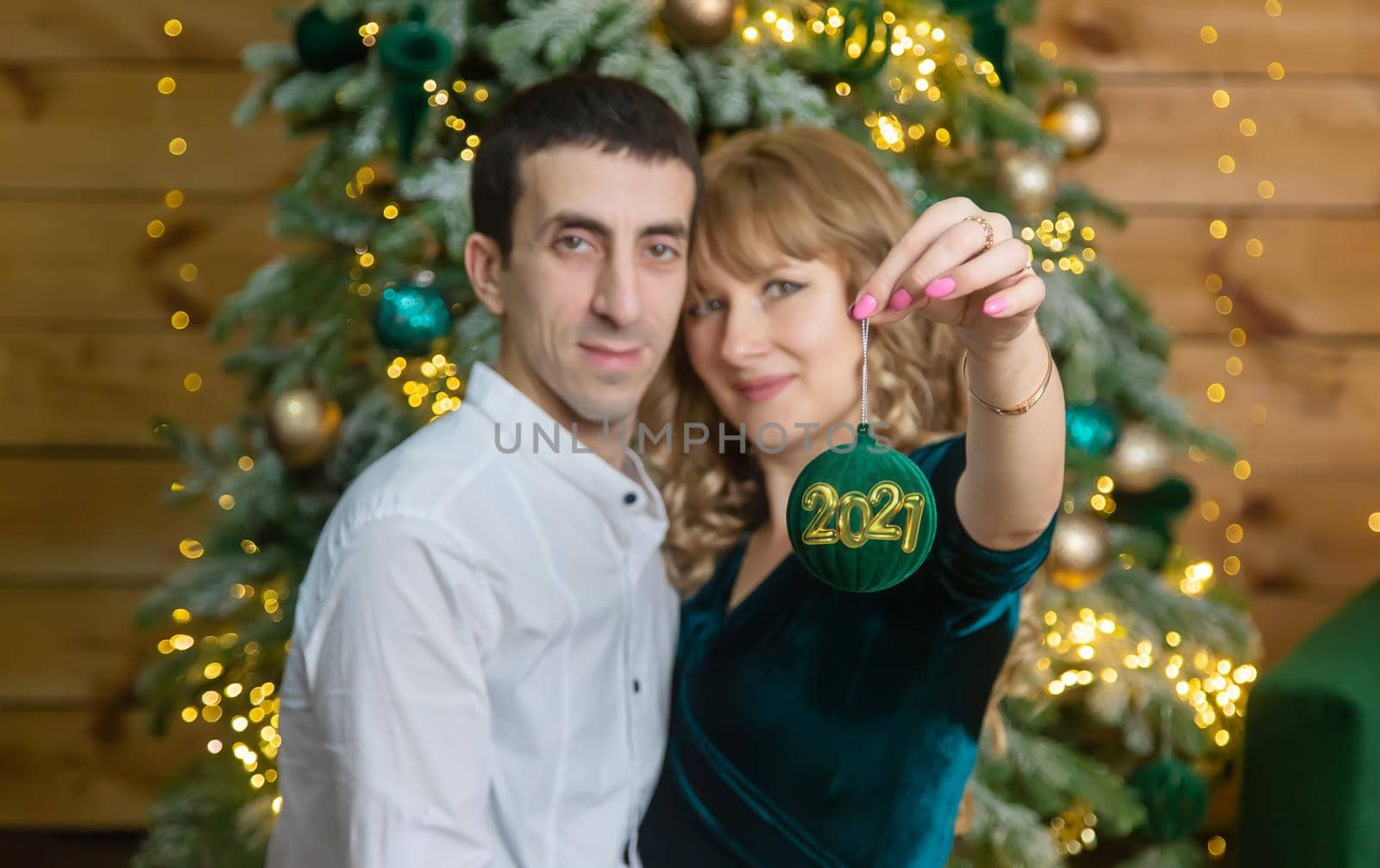 Christmas man and woman hold decoration. Selective focus. Holiday.