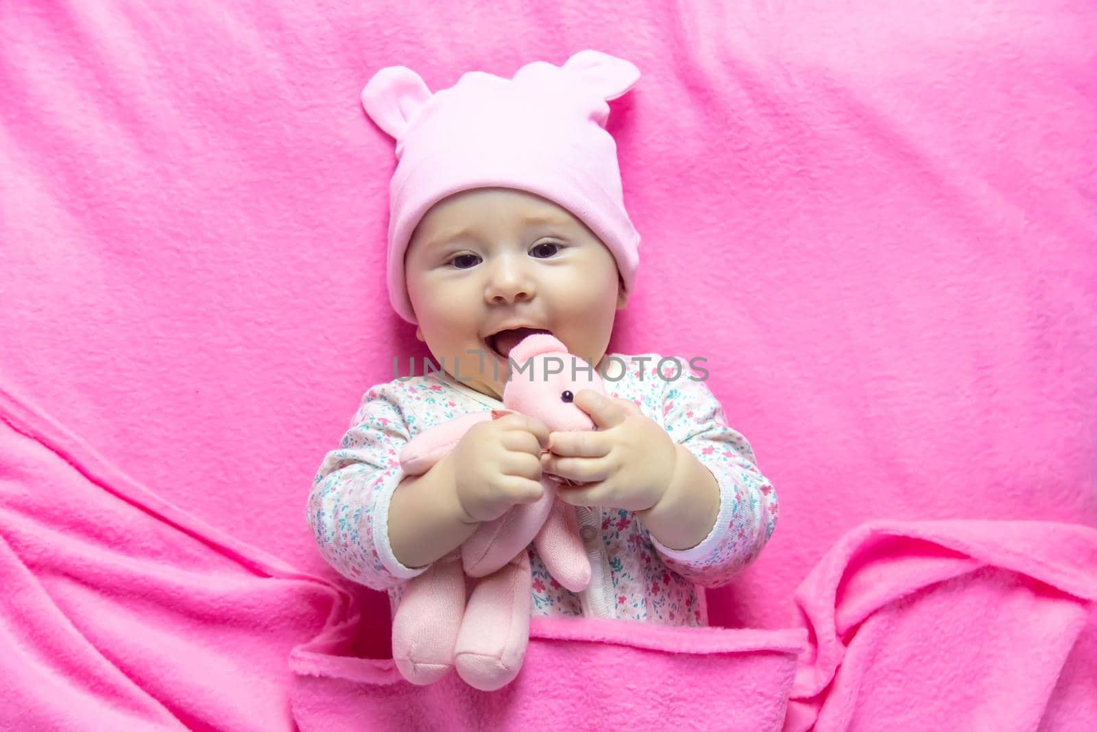 Baby sleeps with a bear. Selective focus. people.