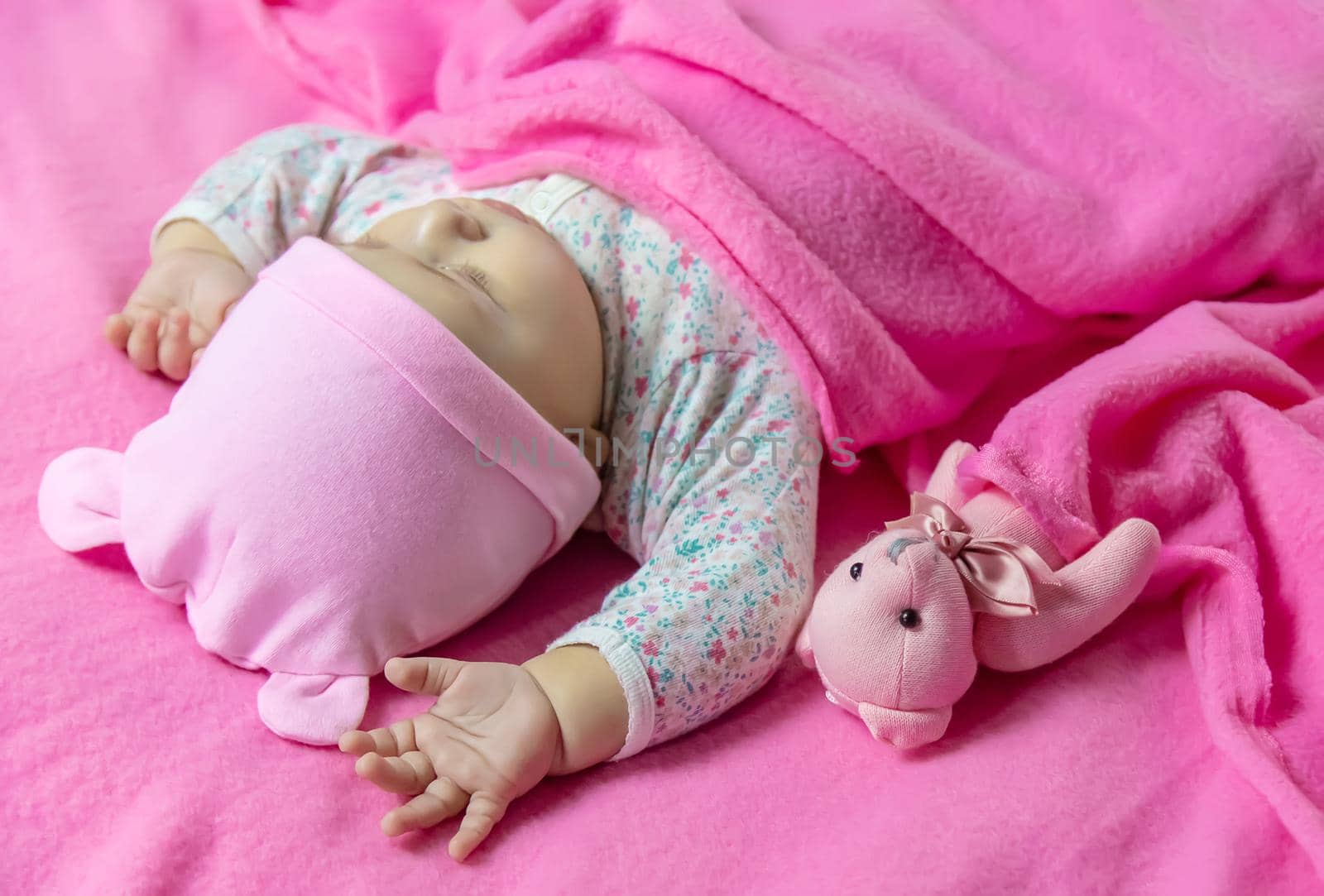 Baby sleeps with a bear. Selective focus. people.