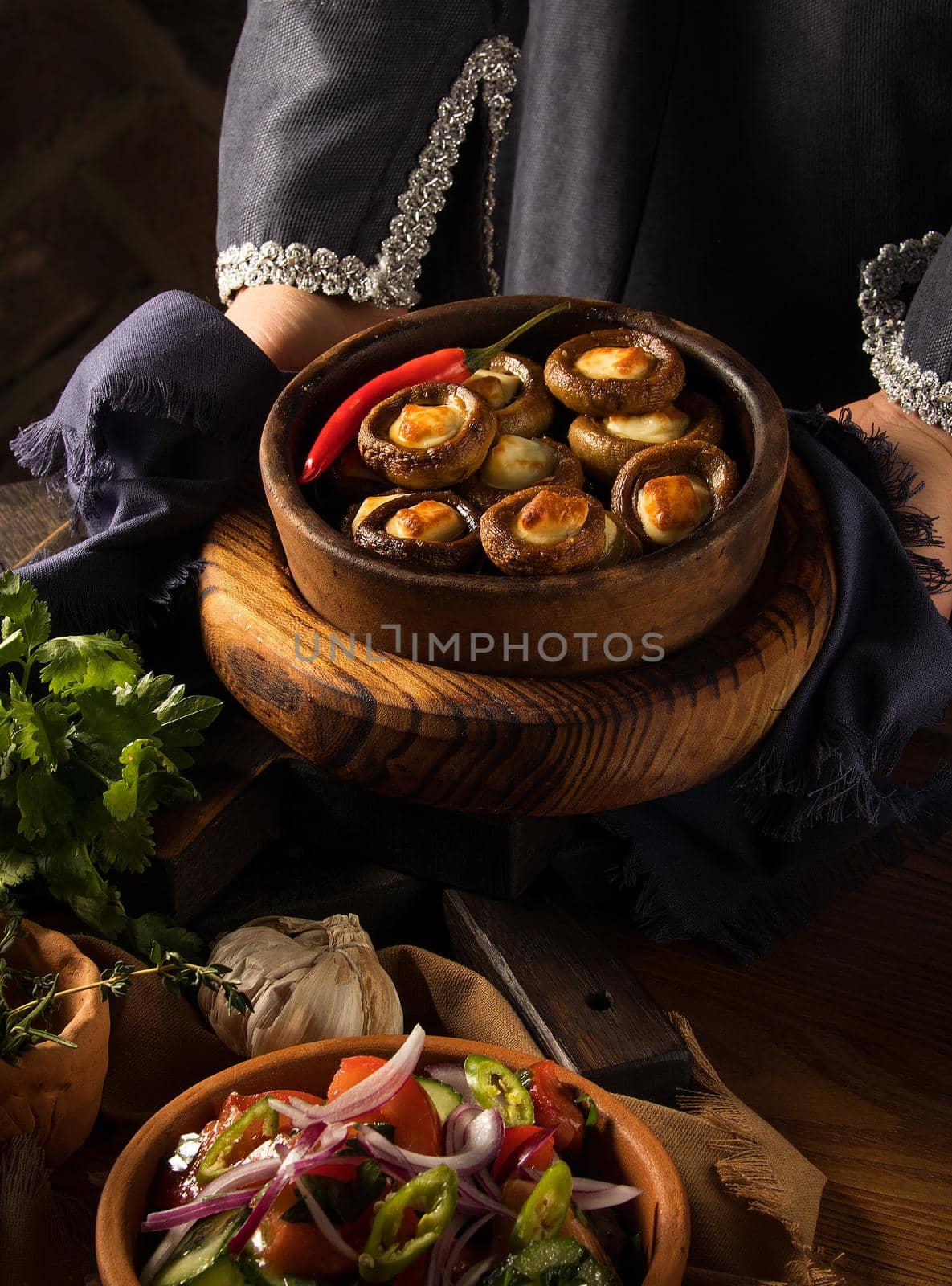 Shot of a person putting dishes on the table by A_Karim