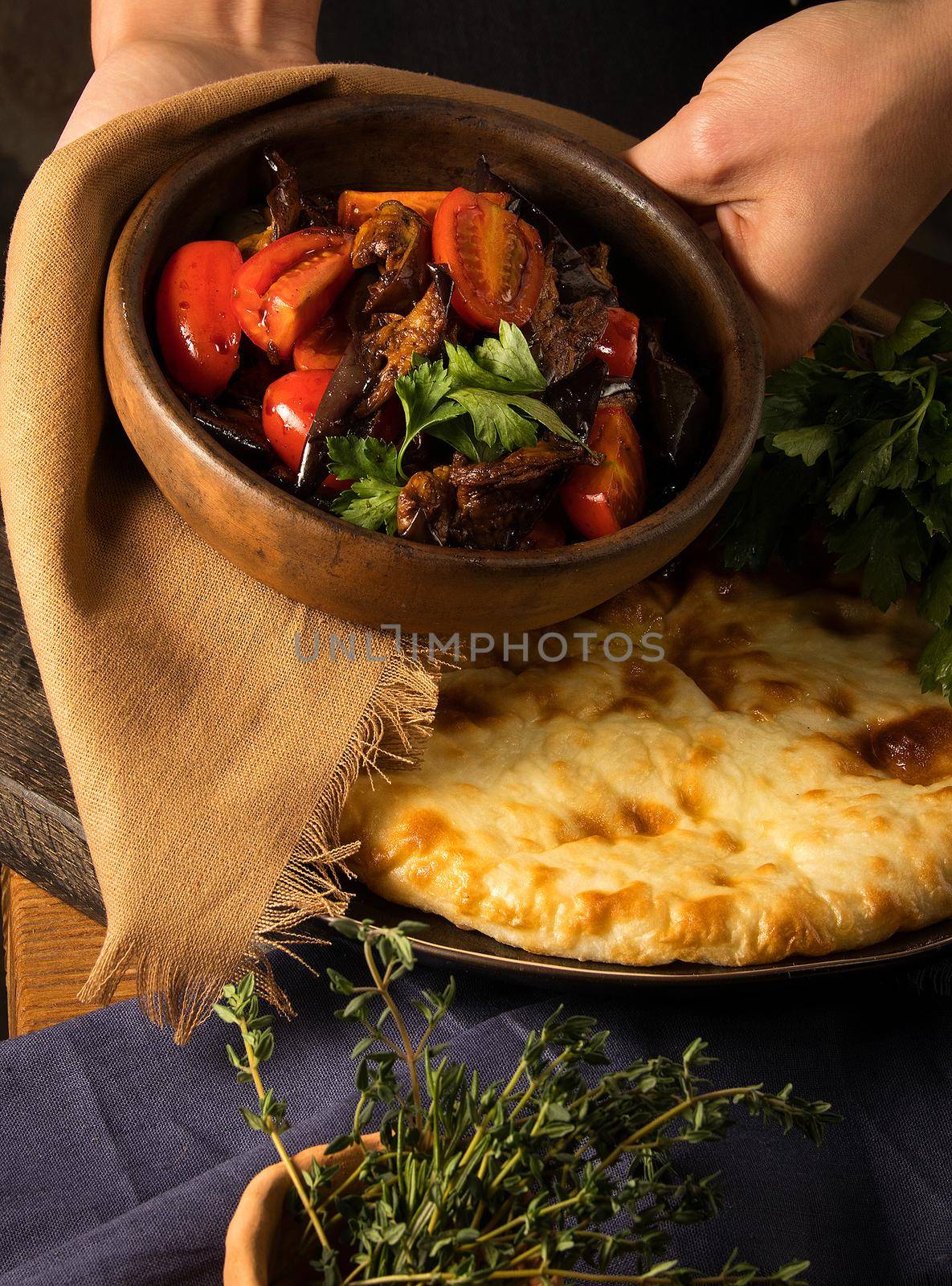 Vertical shot of a chef serving a gourmet salad dish by A_Karim