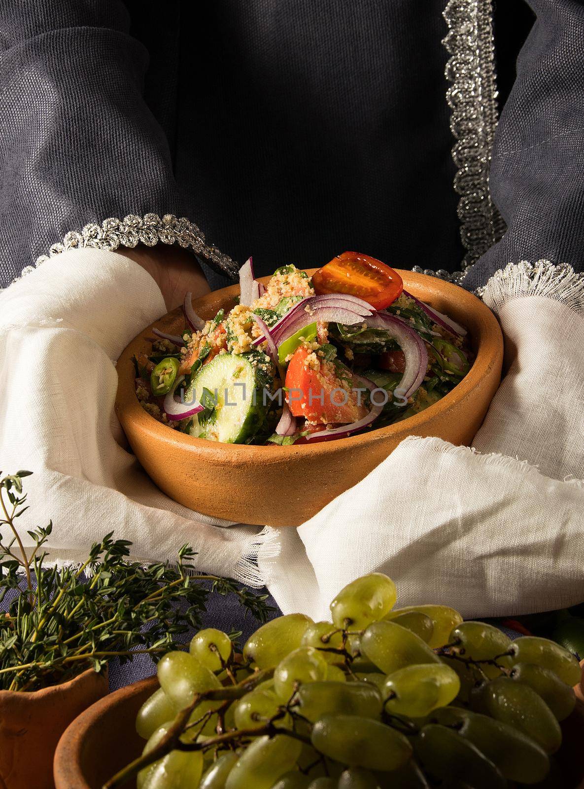 A vertical picture of a dish in hands