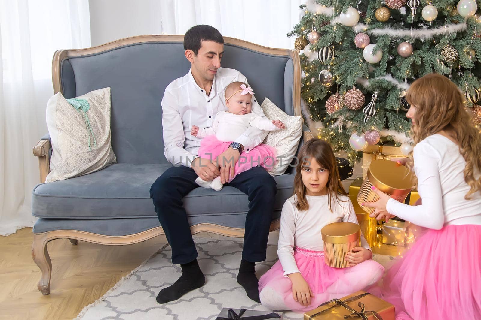 Christmas family on a beautiful background. Selective focus. by yanadjana