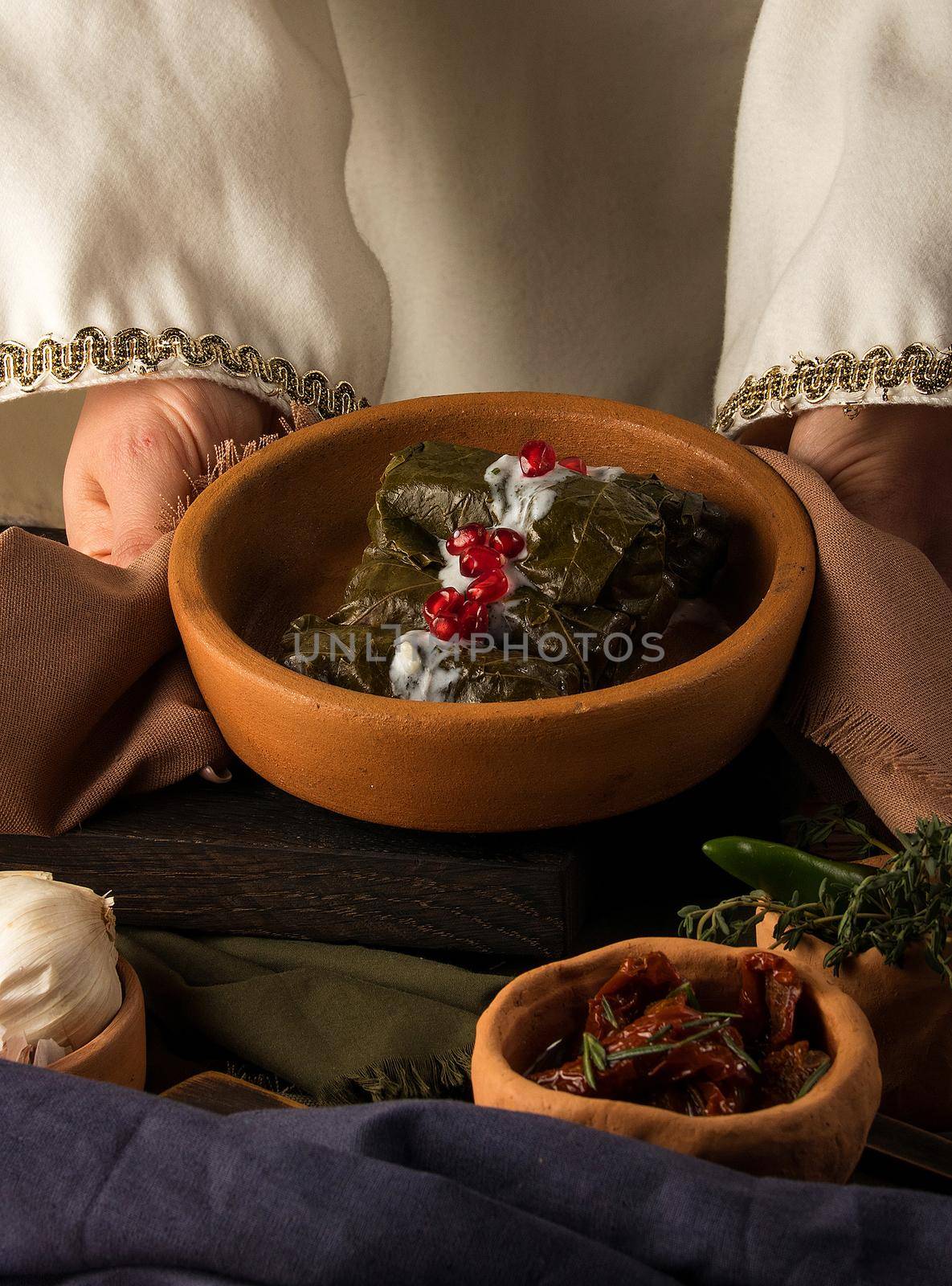 Close up shot of a dolma covered in grape leaves by A_Karim