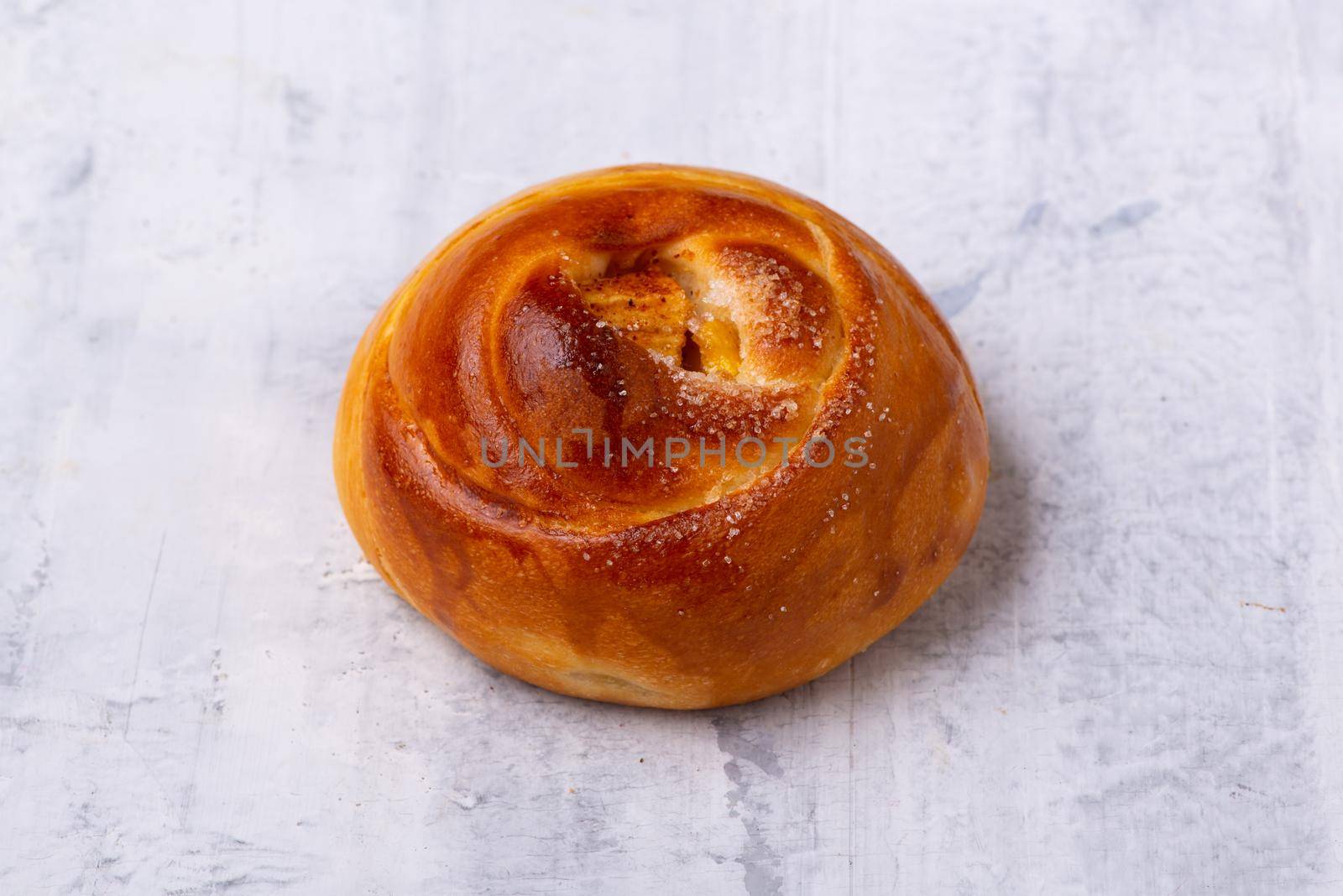 A close up shot of a bagel on a white surface