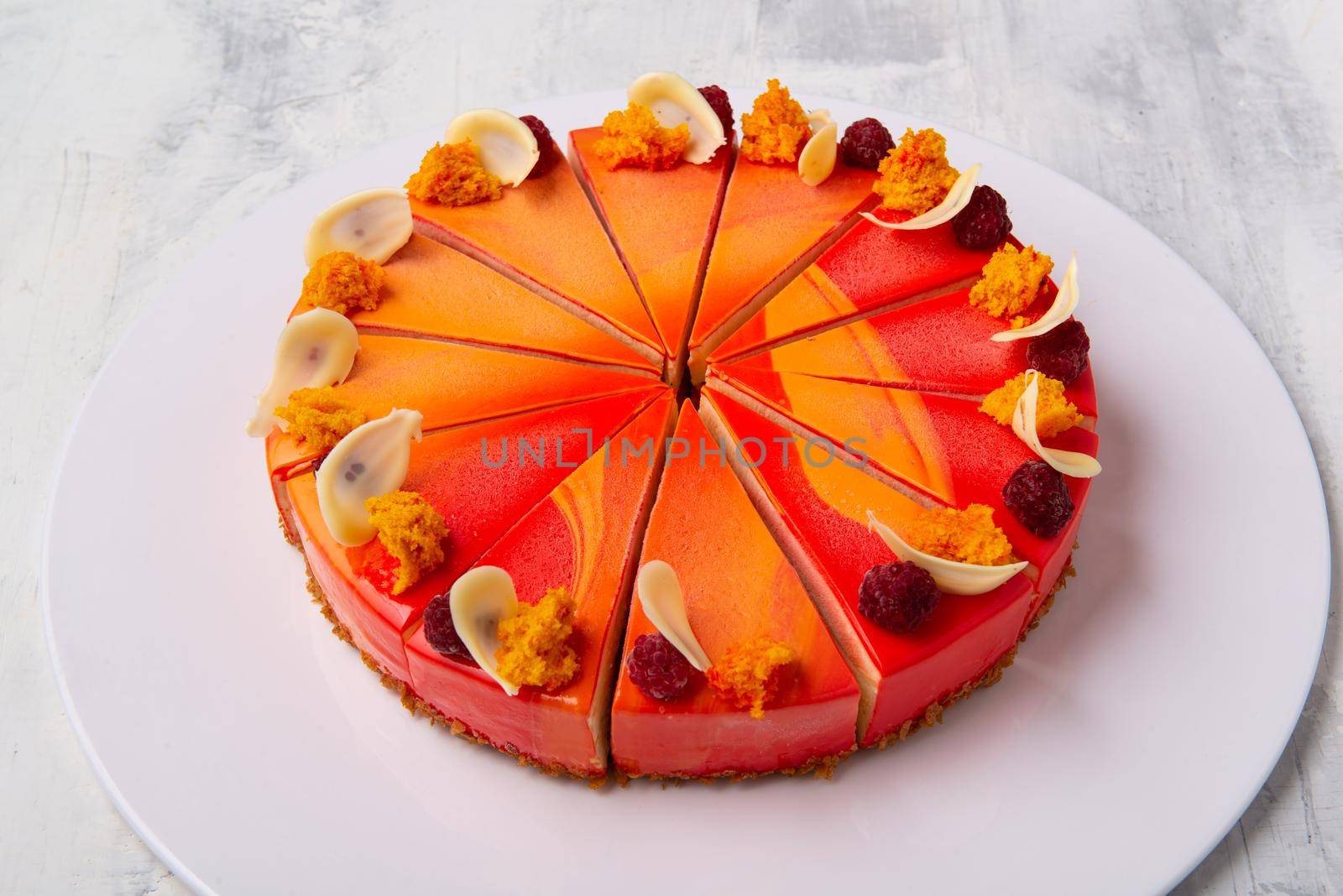 A top view shot of sliced cakes on a white plate