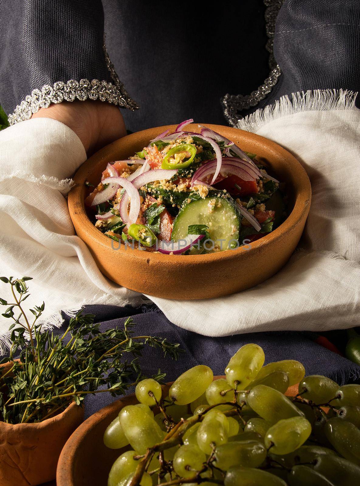 A vertical picture of a dish in hands