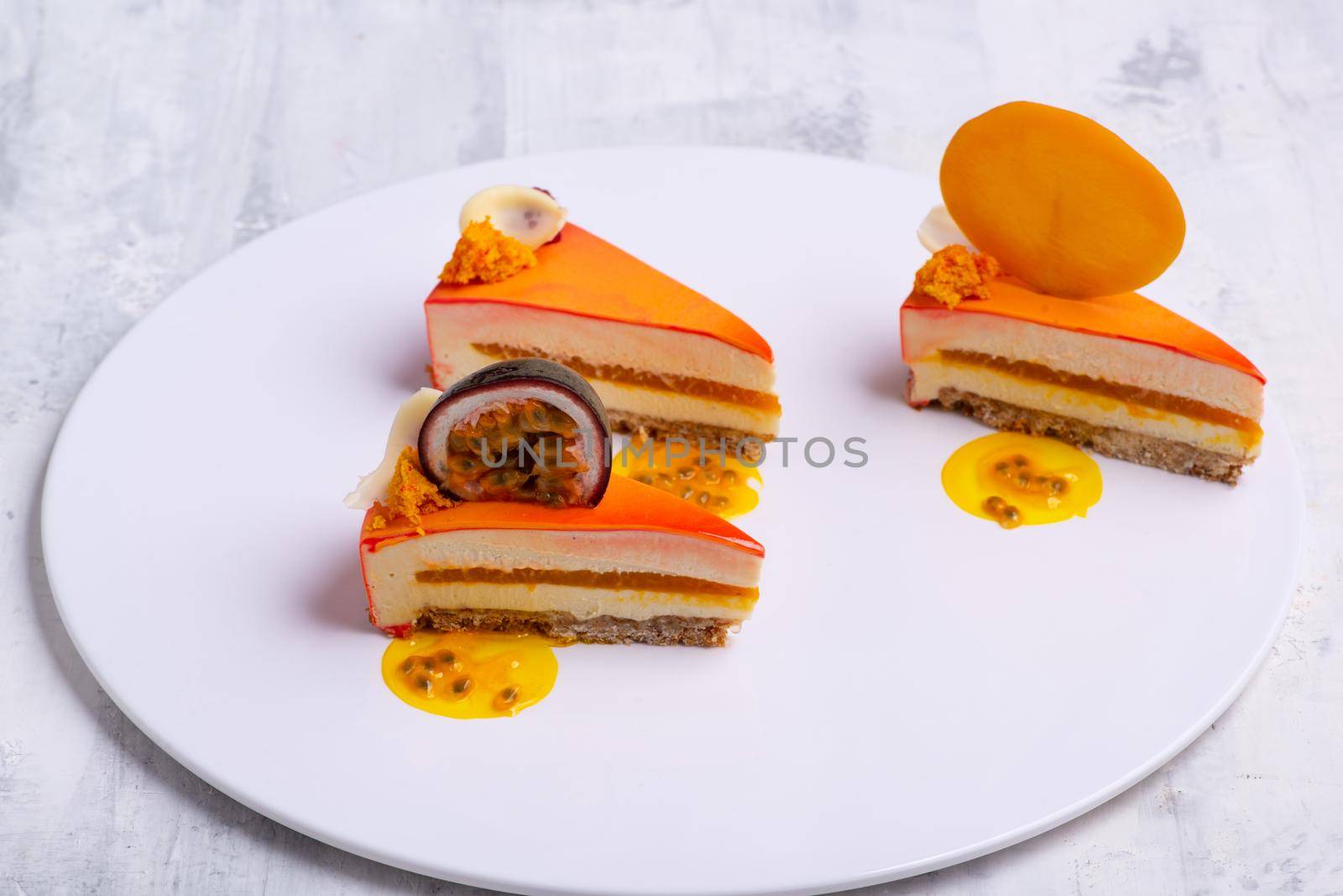 A top view shot of sliced orange cakes on a white surface