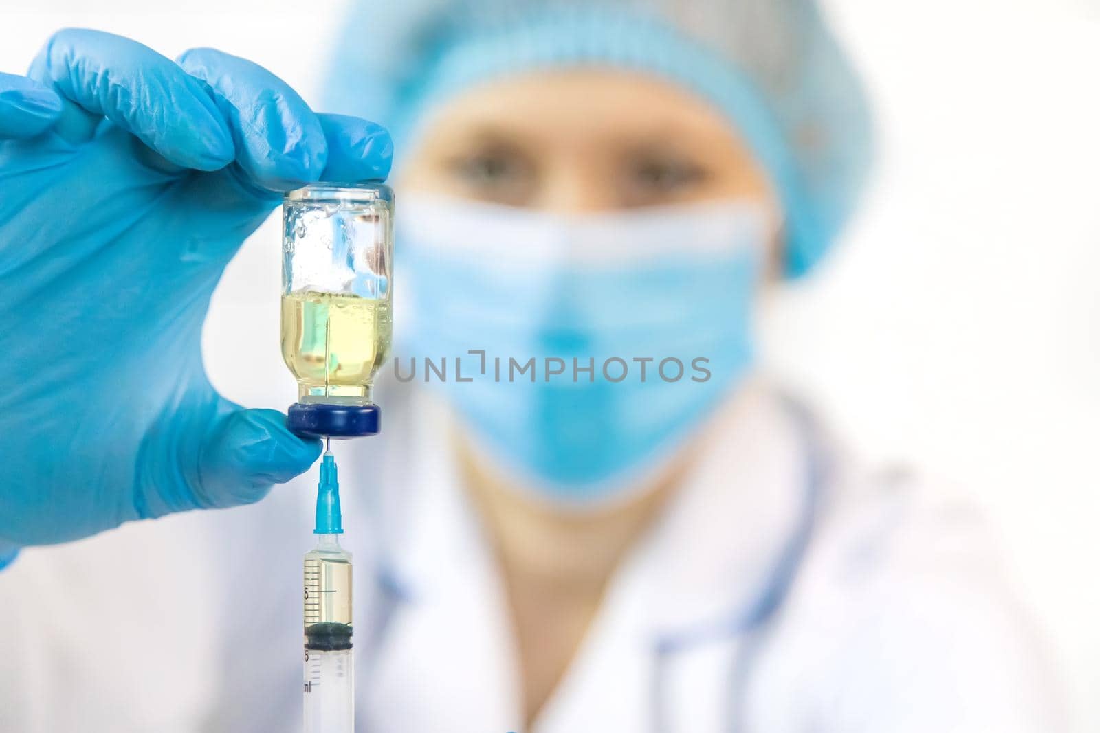 Doctor filling syringe with medication, closeup. Vaccination and immunization. Selective focus. Vaccine.