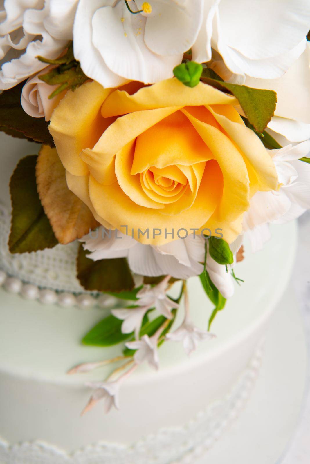 Close up shot of designed rose flowers on a white cake. by A_Karim