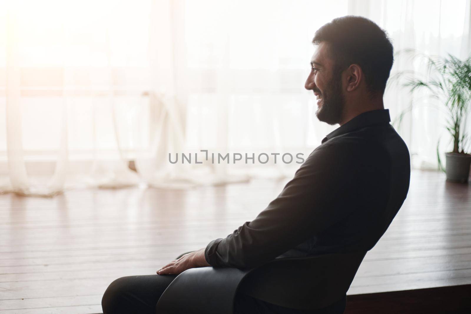 businessman sitting in his new office . startup concept. by SmartPhotoLab